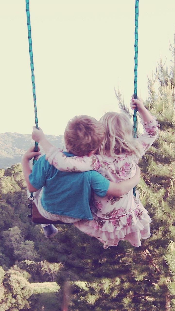 Cute Couple Swing In Forest
