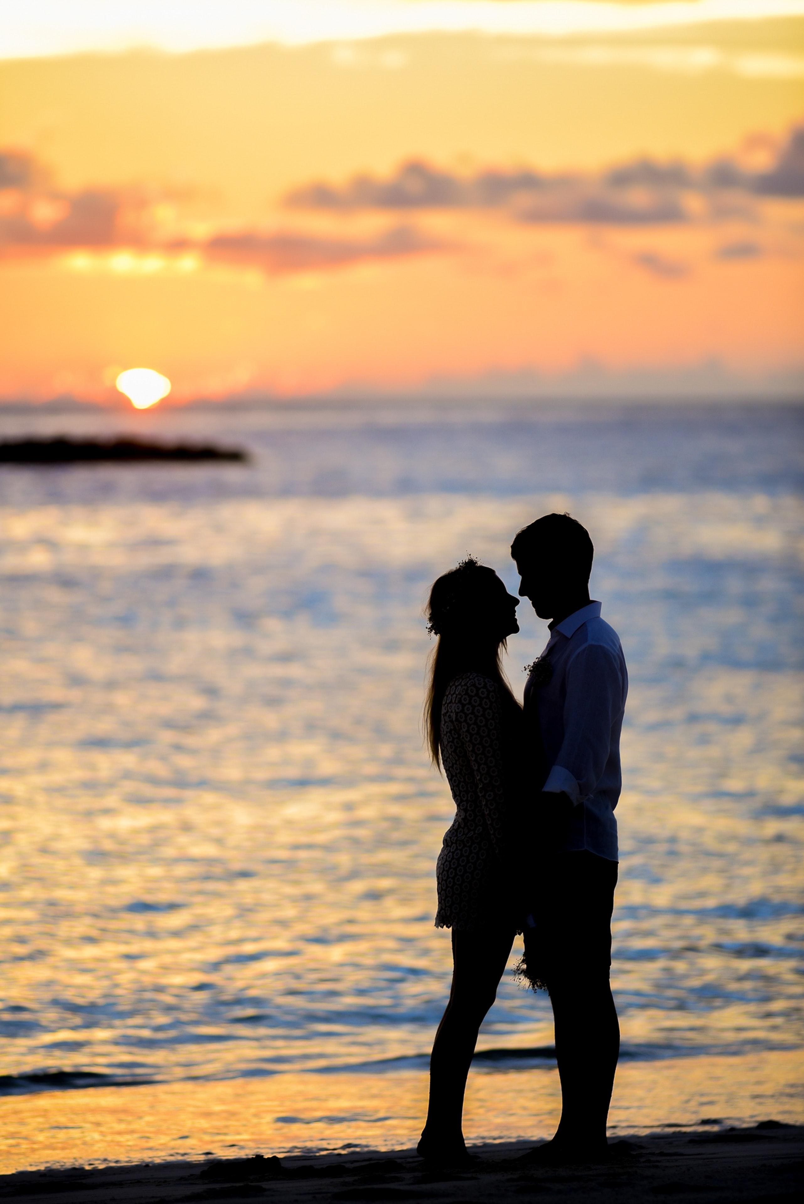 Silhouette of Couple on Seashore · Free