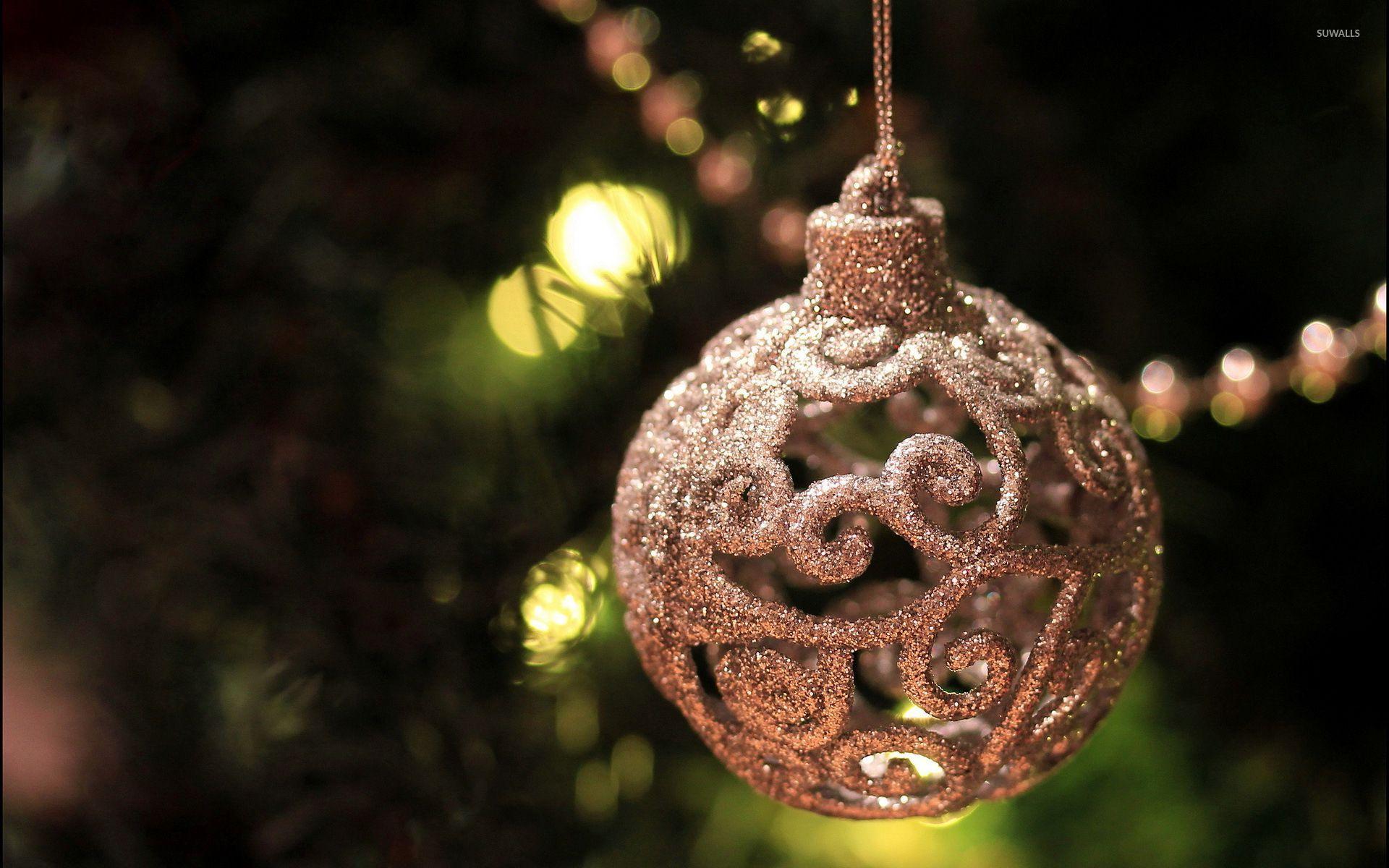 Beautiful silver bauble in the Christmas tree wallpaper