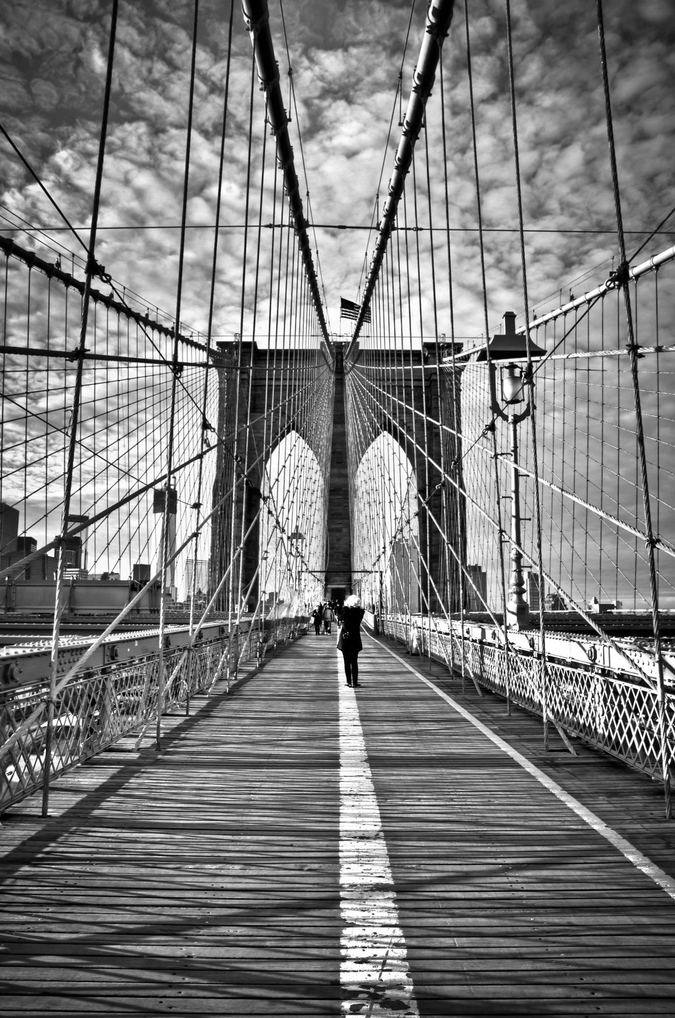 Girl photographing Brooklyn Bridge