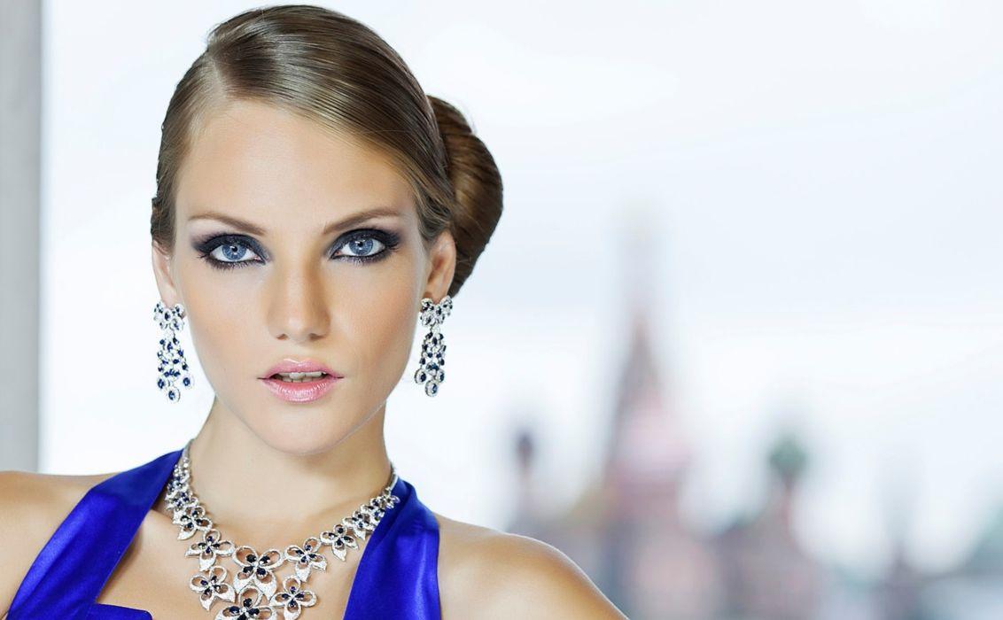 Delicate earrings blue eyes stare face elegant beautiful