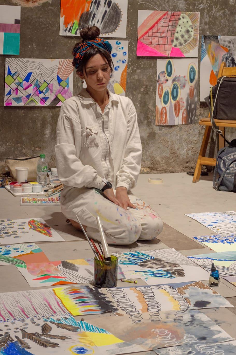 HD wallpaper: woman sitting near painting lot, creativity