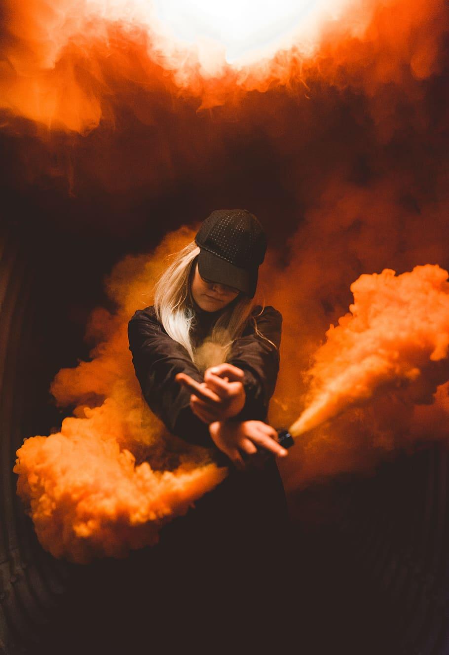 HD wallpaper: smoke bomb, middle finger, person, hat, orange, girl, dark