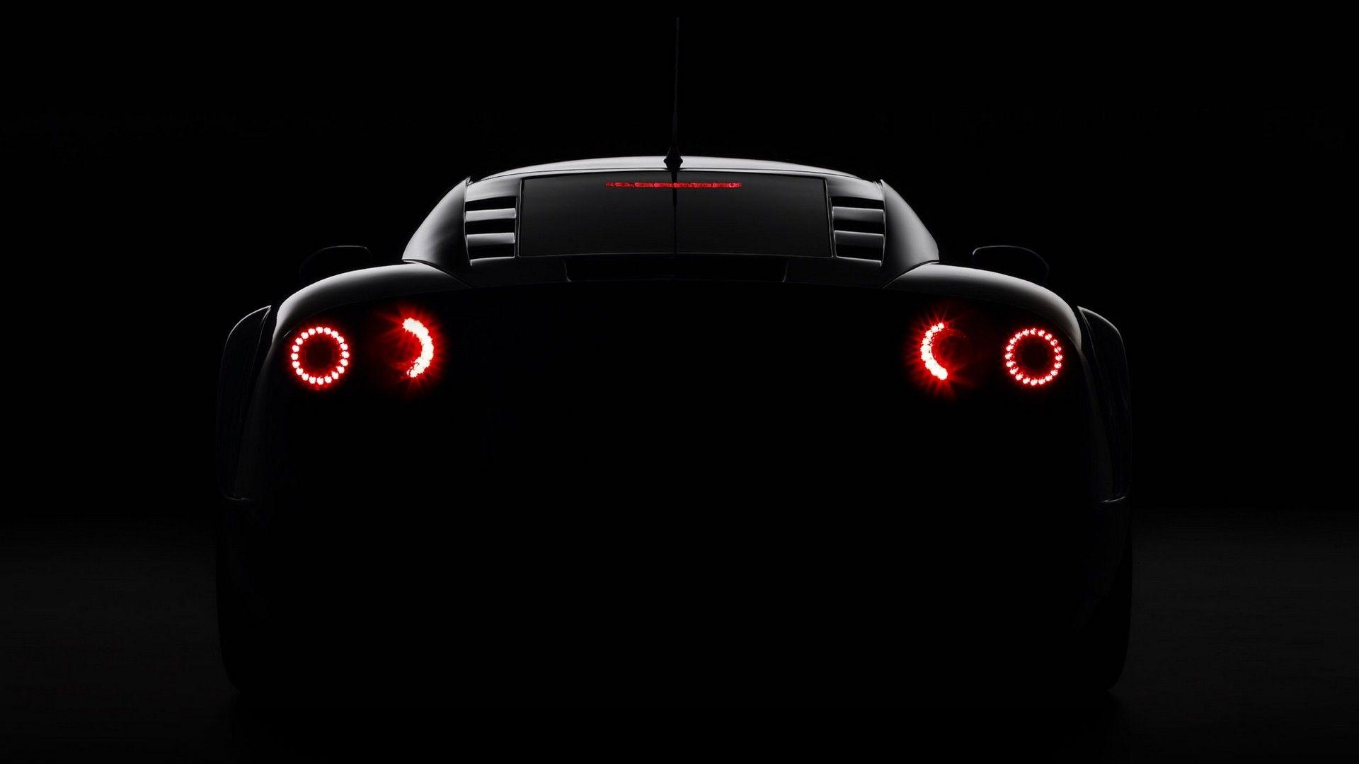 Noble M600 dark glowing rear angle view sports car wallpaper