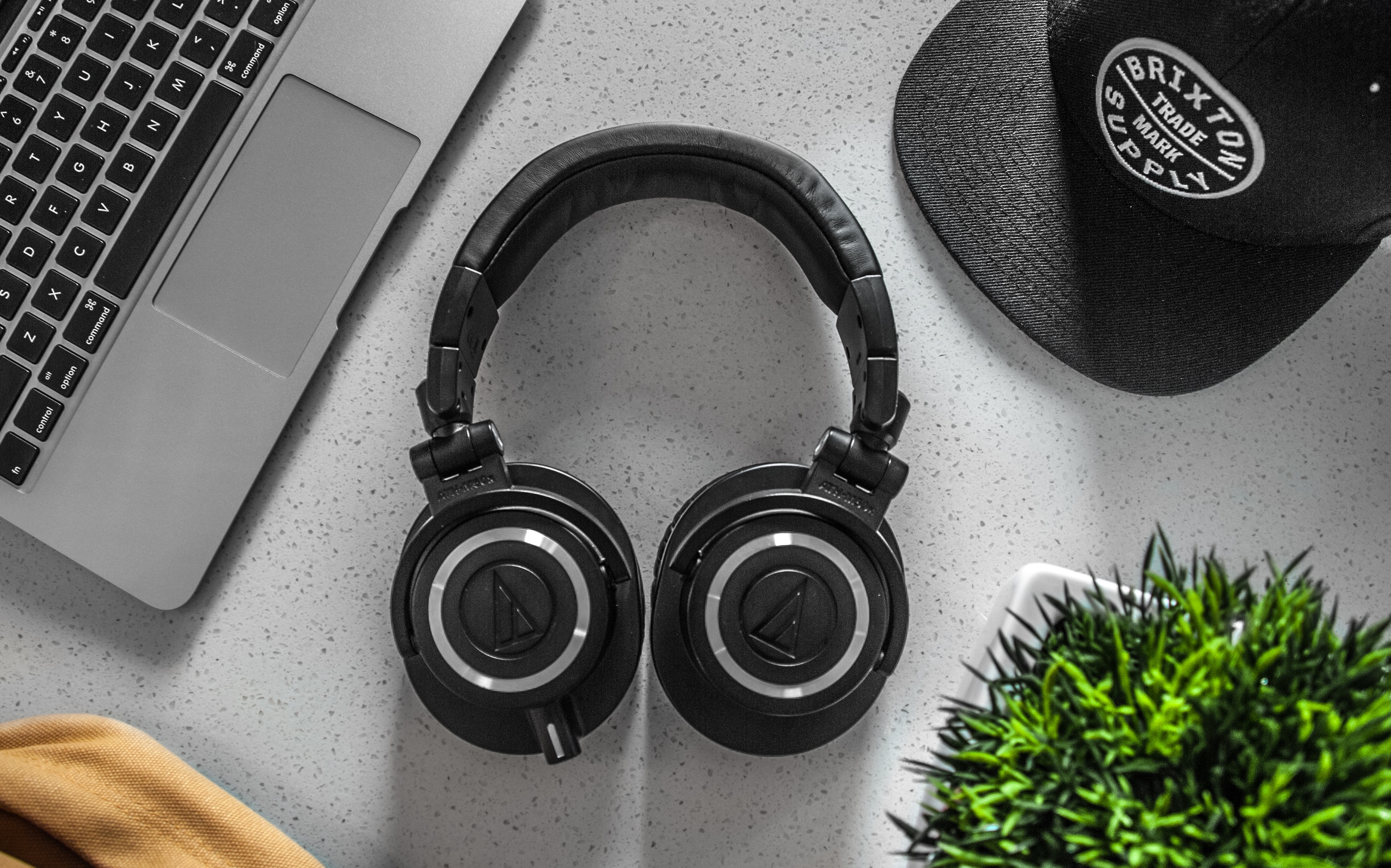 Black Wireless Headphones On White Table · Free