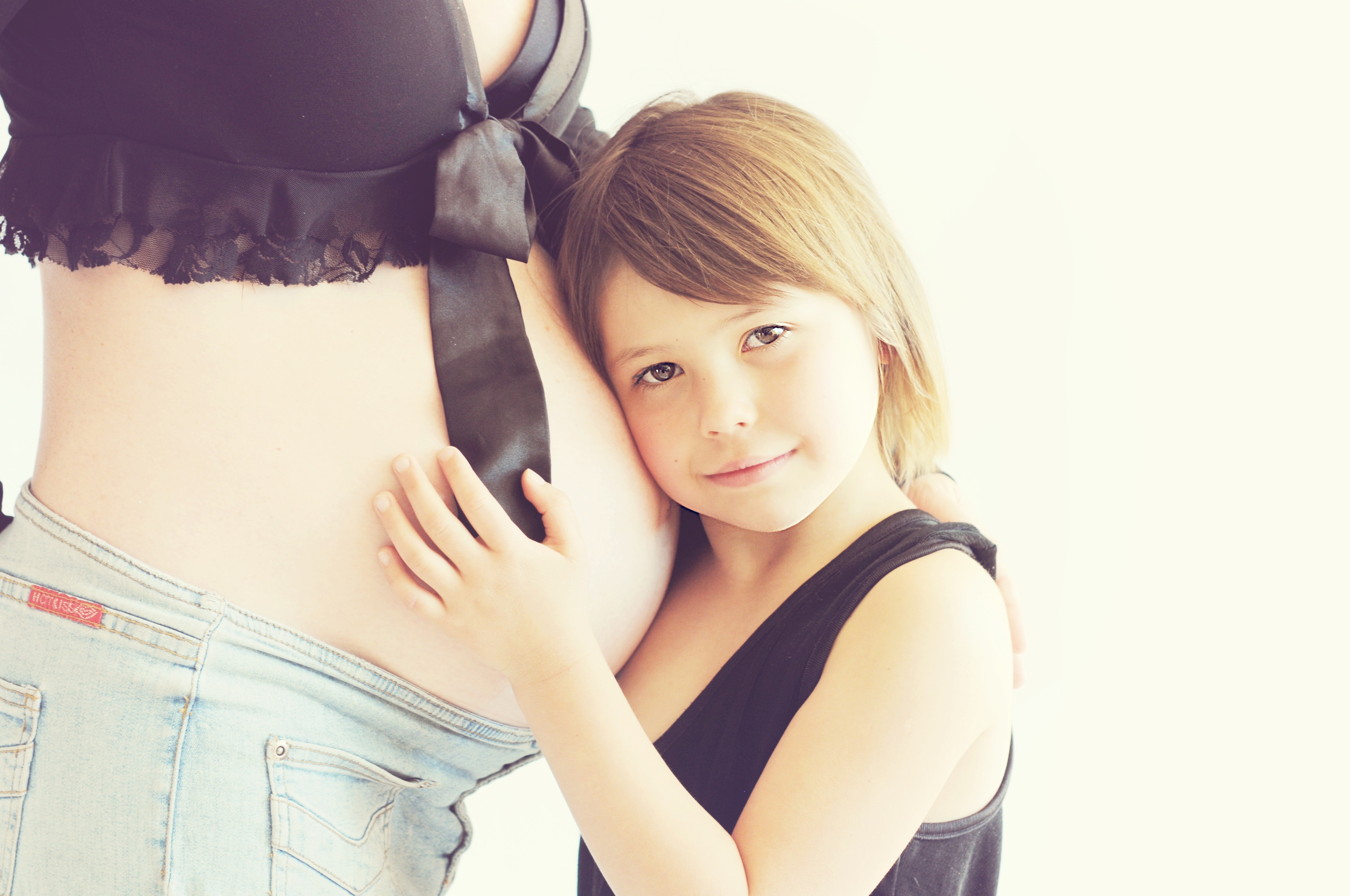 Close Up Photo Of Girl Standing Beside Pregnant Woman · Free