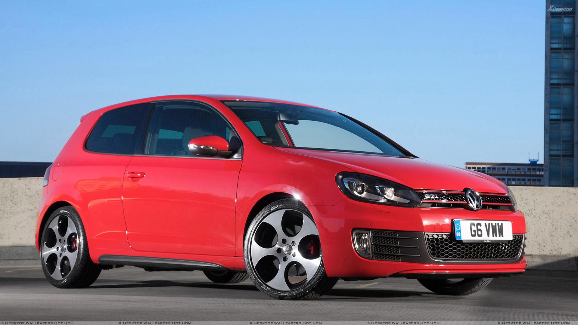 Volkswagen Golf VI GTI In Red Side Front Pose Wallpaper
