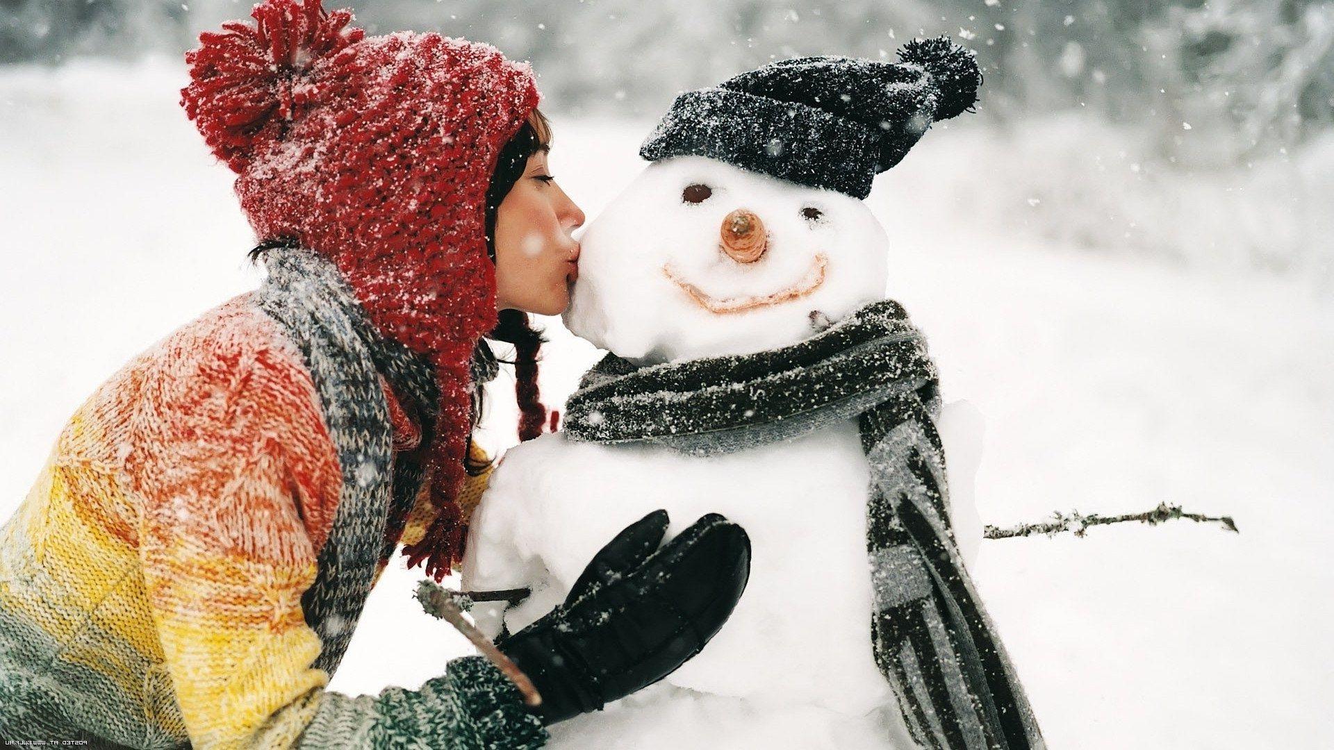 Winter snow snowman girl kiss