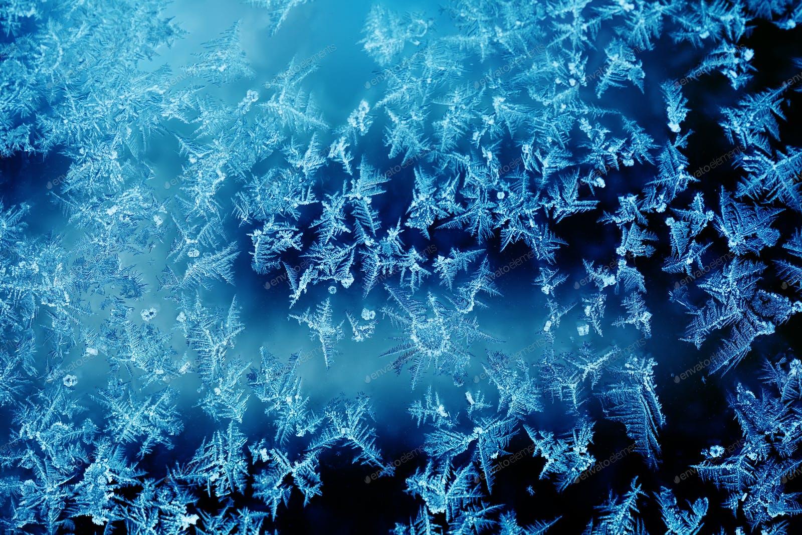 Ice flowers and frozen window macro view. Frost texture pattern. photo by Besjunior on Envato Elements