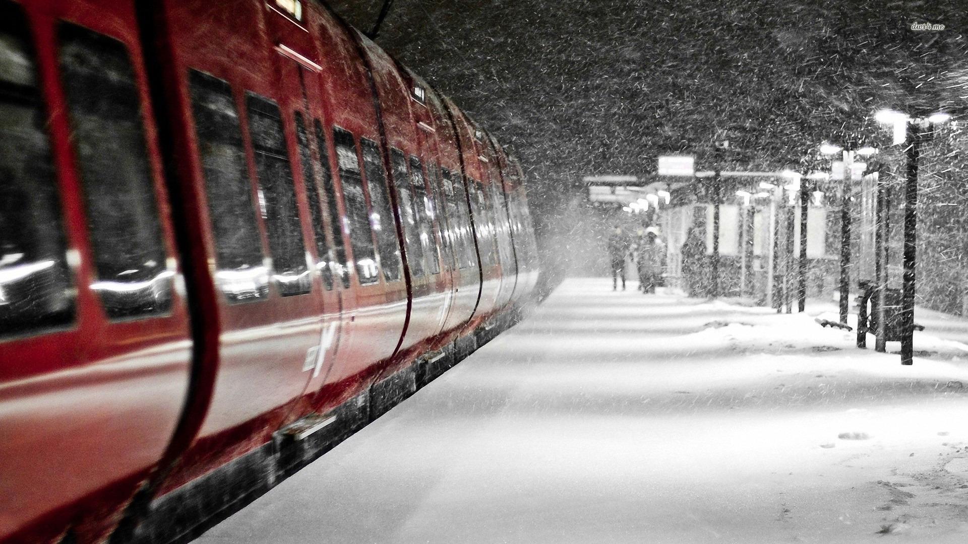 Red train in the snow storm wallpaper