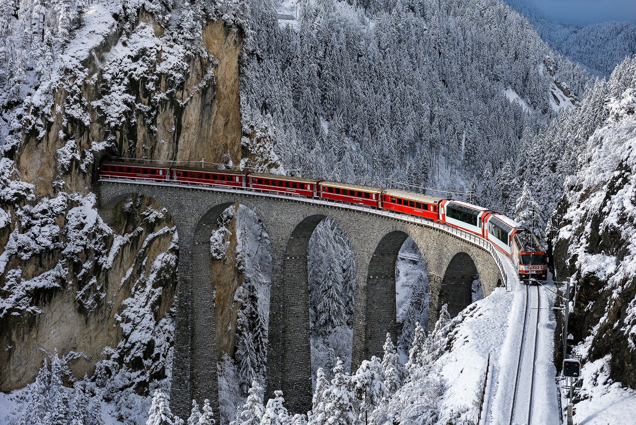 train railway bridge winter snow trees forest mountain