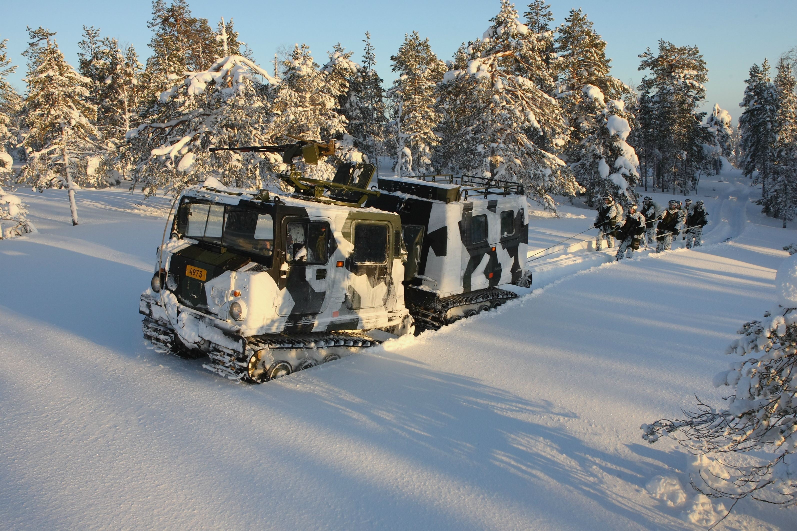 White and black military truck, Hägglunds BV206, Swedish