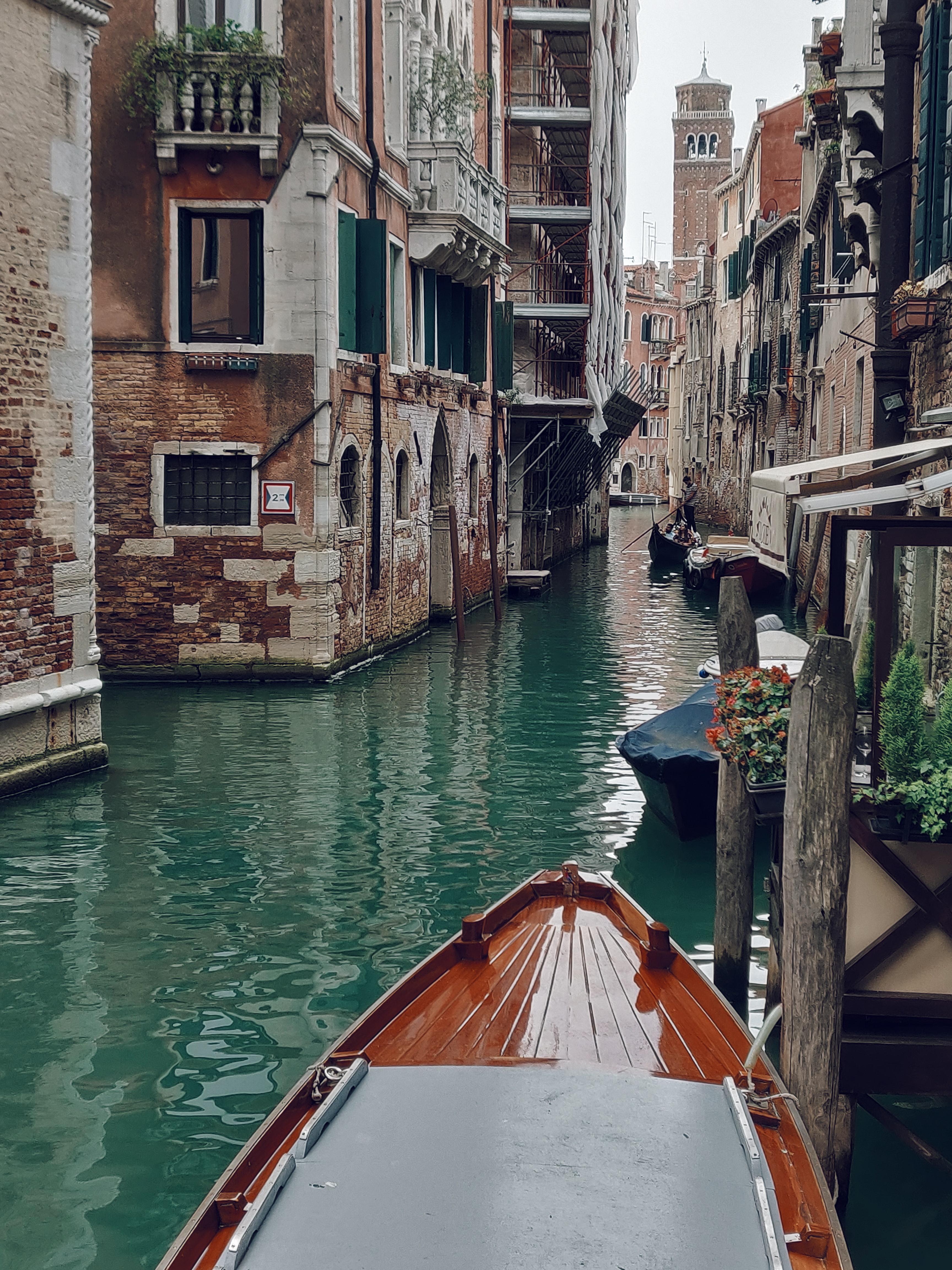 Brown Boat Along The Canals Of Venice · Free