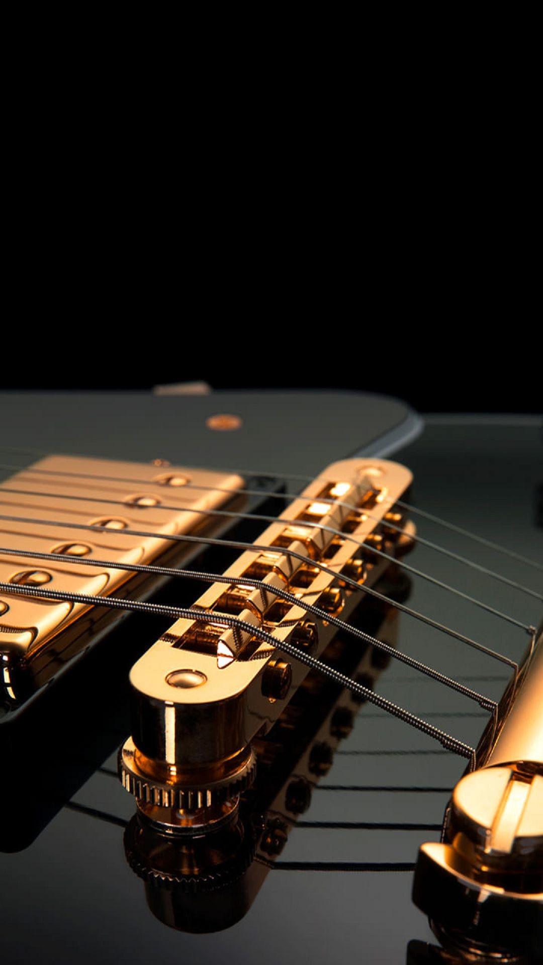 Guitar Strings Black Gold android wallpaper