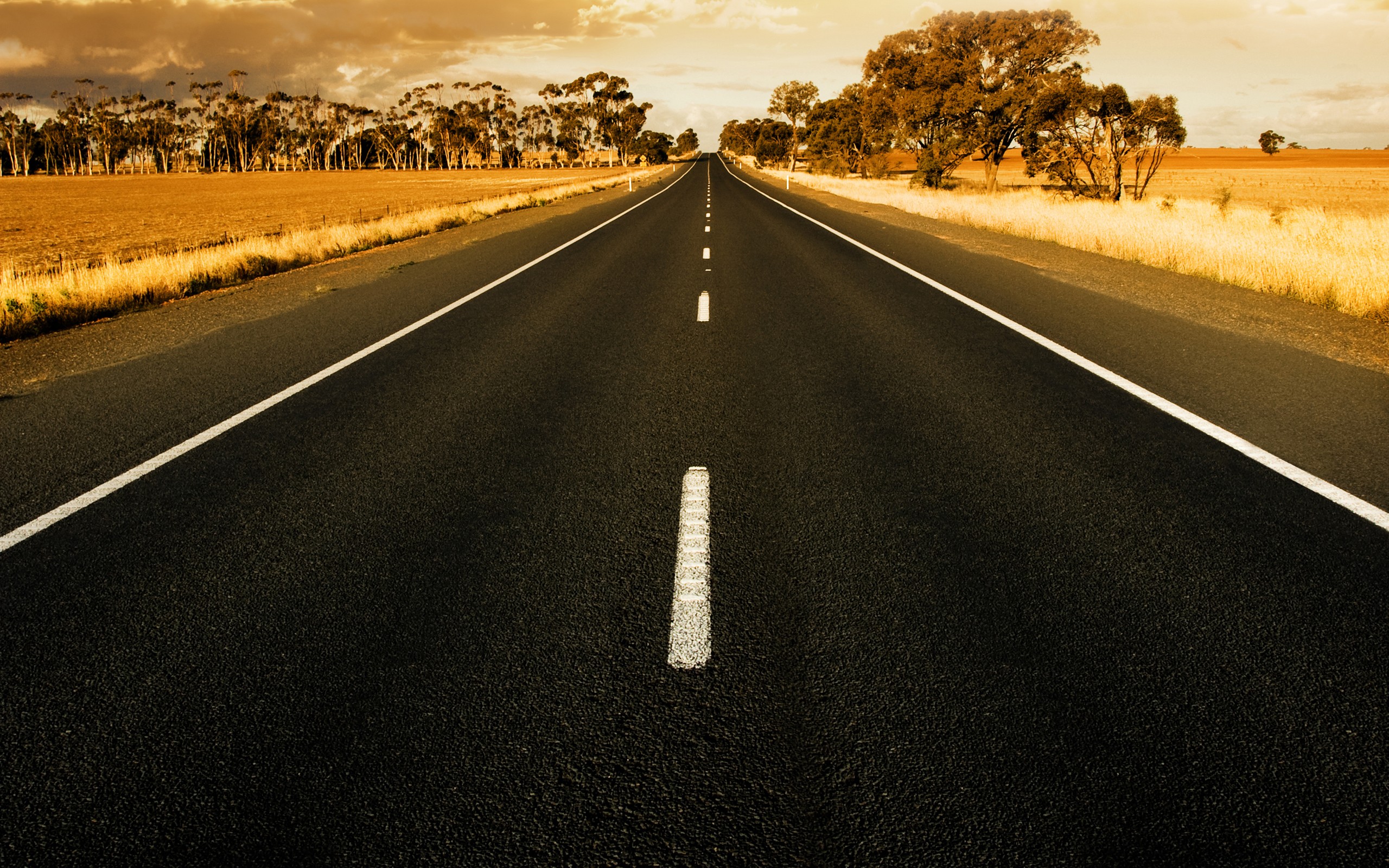 Straight road at sunset in rural australia wallpaper