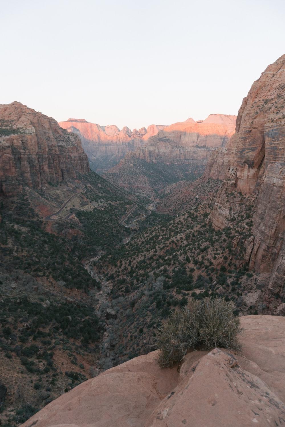 aerial photo of cliff under blue sky at daytime photo