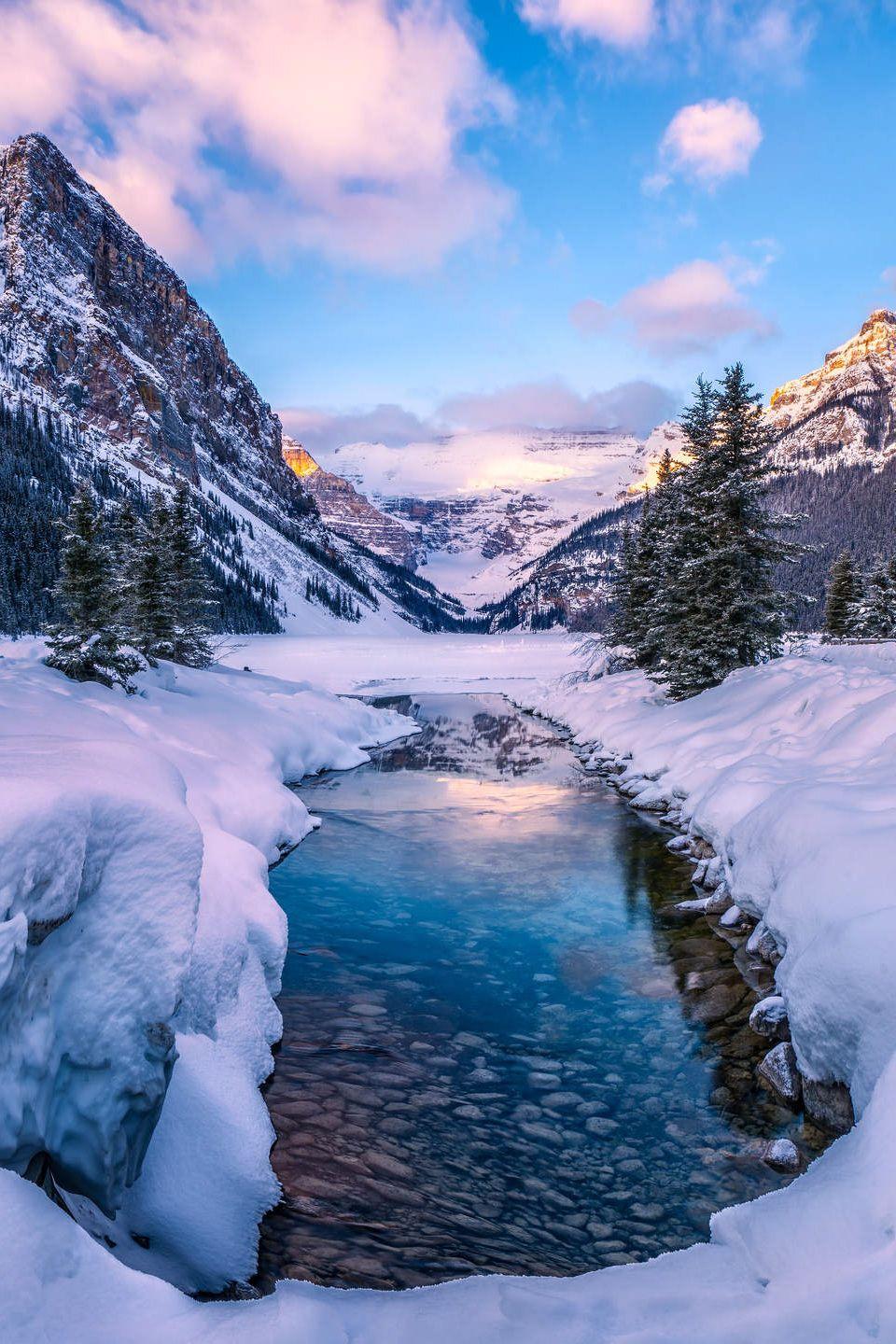 A beautiful golden sunrise at Lake Louise. Nature, Winter snow, Wallpaper background