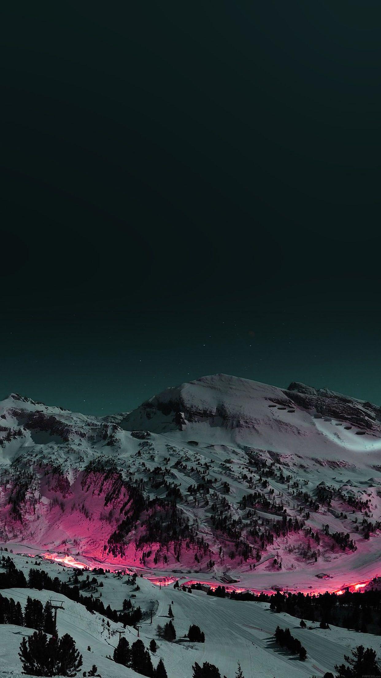 Alpine mountain at night. Snow, lights. iPhone wallpaper