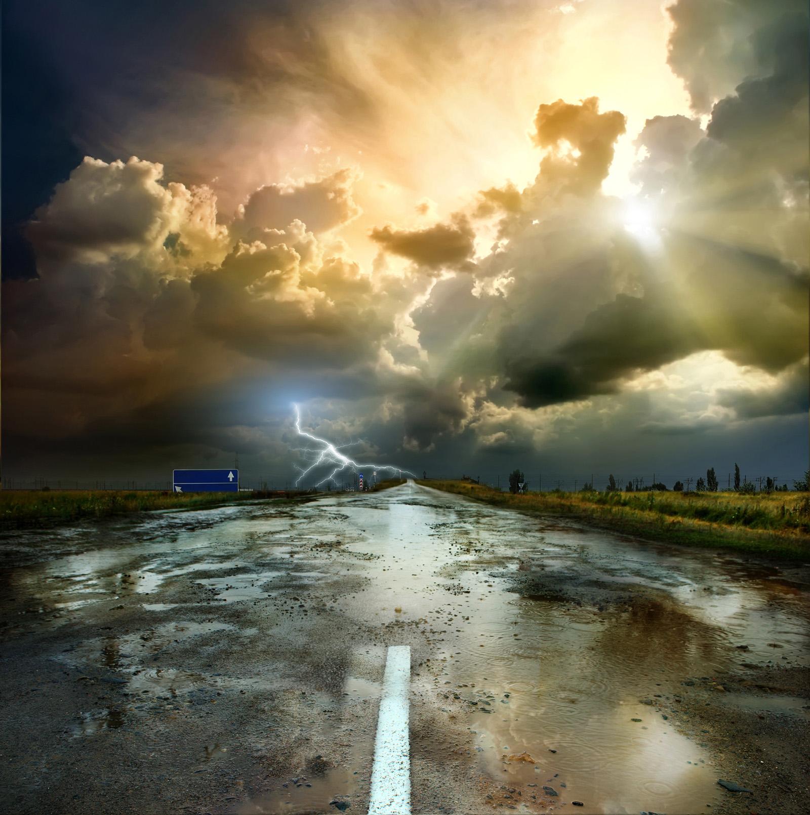 Sun and rain clouds road 51042