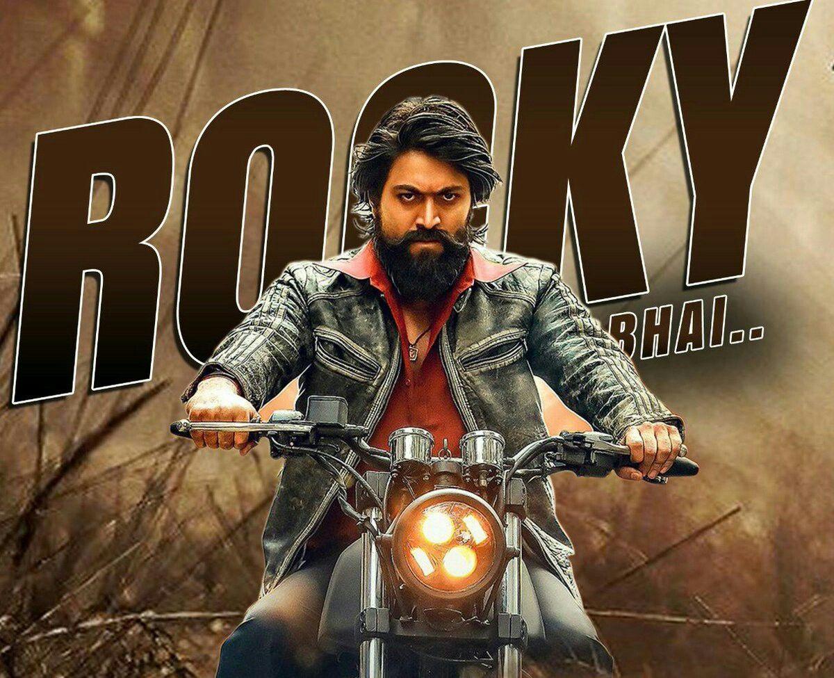 Download Kgf Rocky Bhai Smoking Near Gun Wallpaper | Wallpapers.com