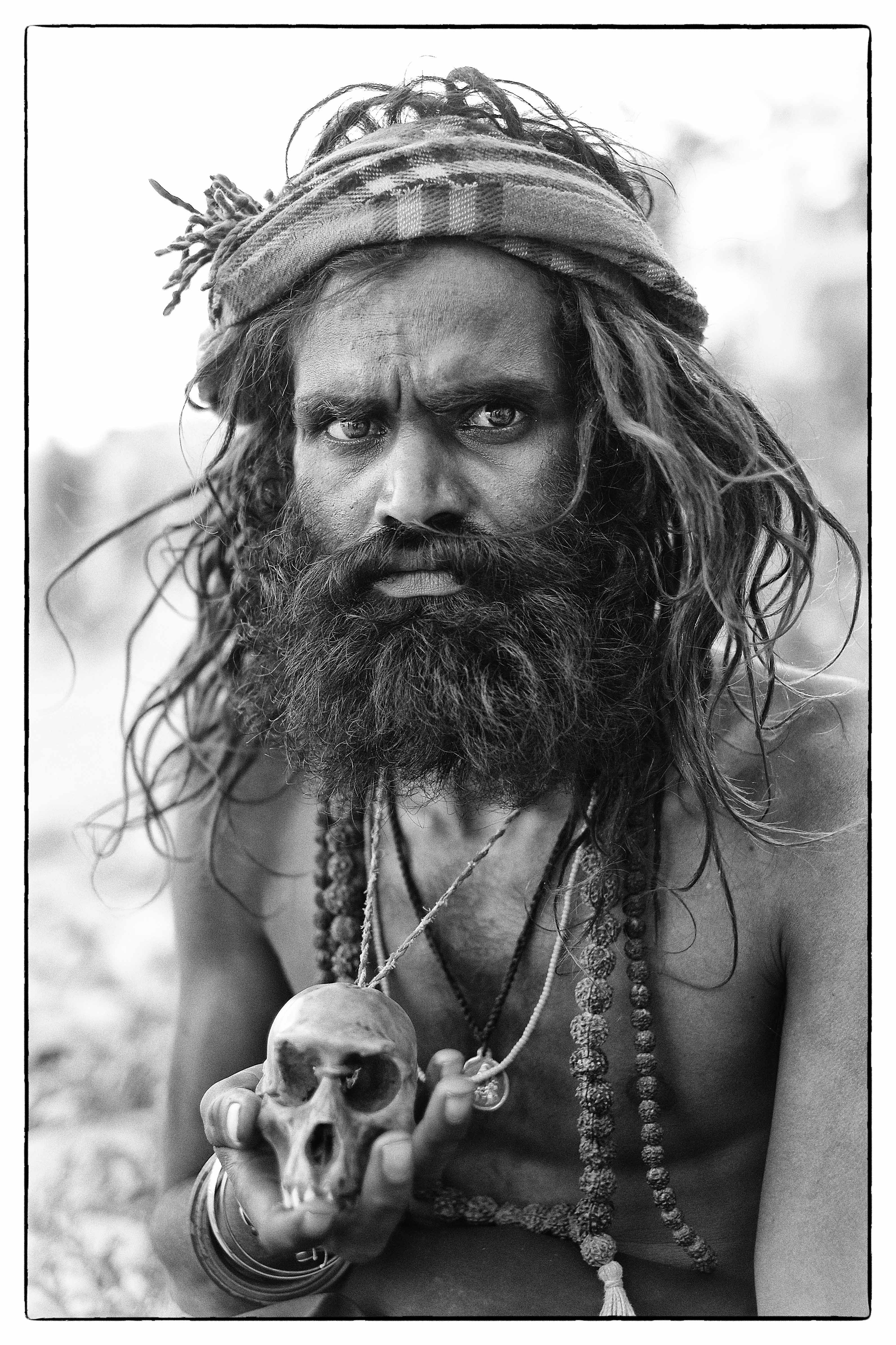 An Aghori sits by the Ganges in Varanasi