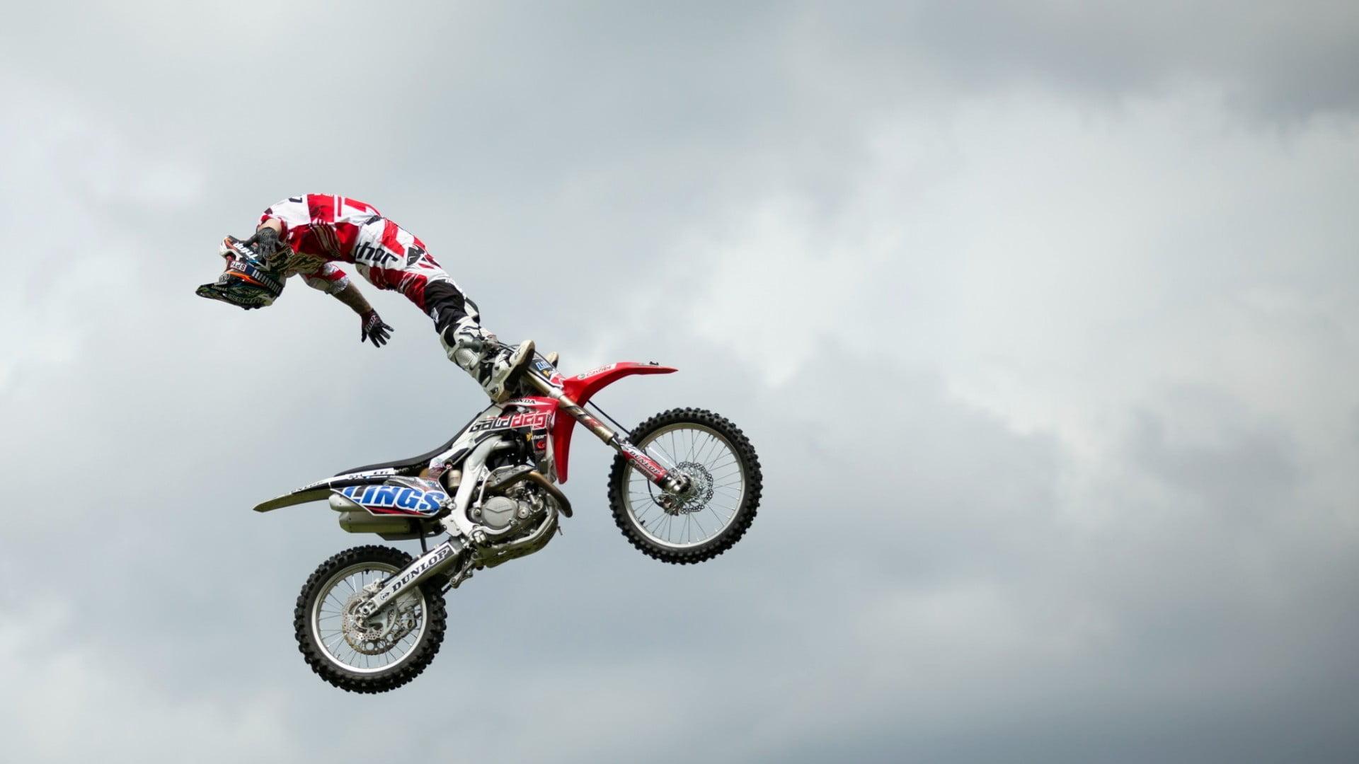 Red and black motocross dirt bike, motocross, stunts HD wallpaper