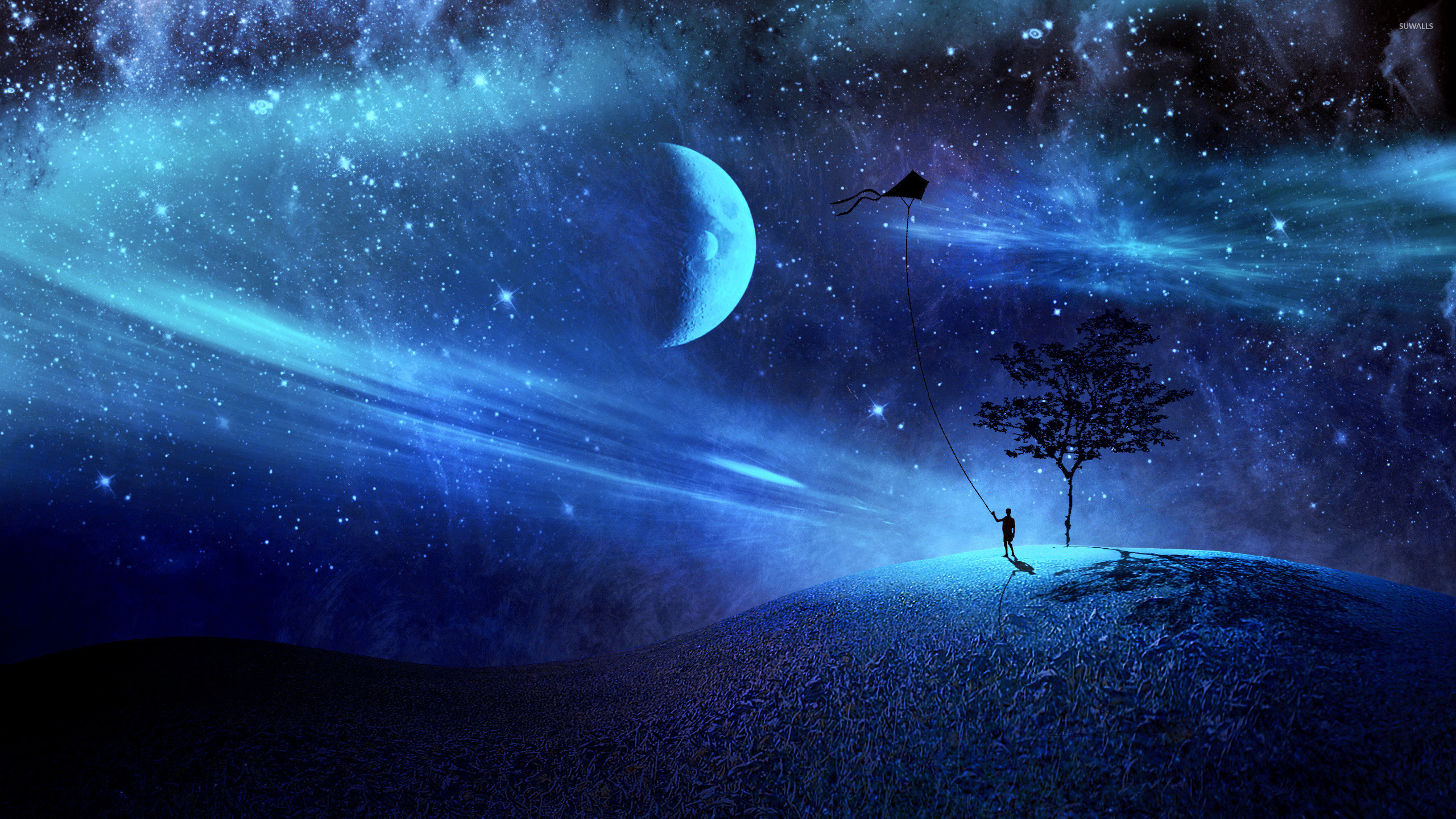 Boy with his kite in a blue night wallpaper