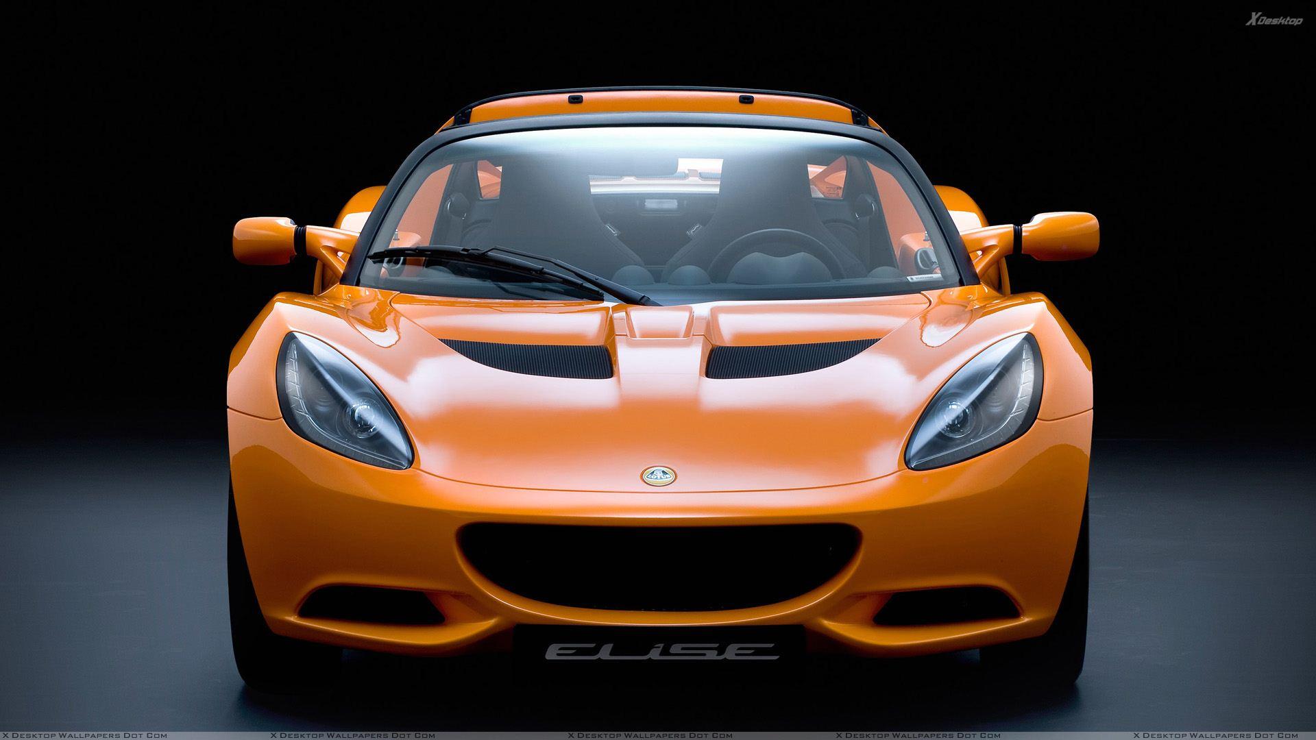 Front Pose Of 2011 Lotus Elise In Orange Wallpaper