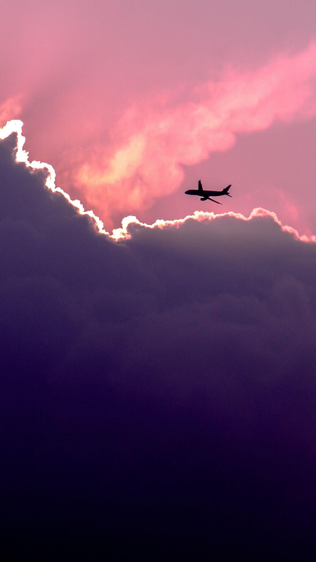 Plane Above Sunset Clouds iPhone 8 Wallpaper. Airplane wallpaper