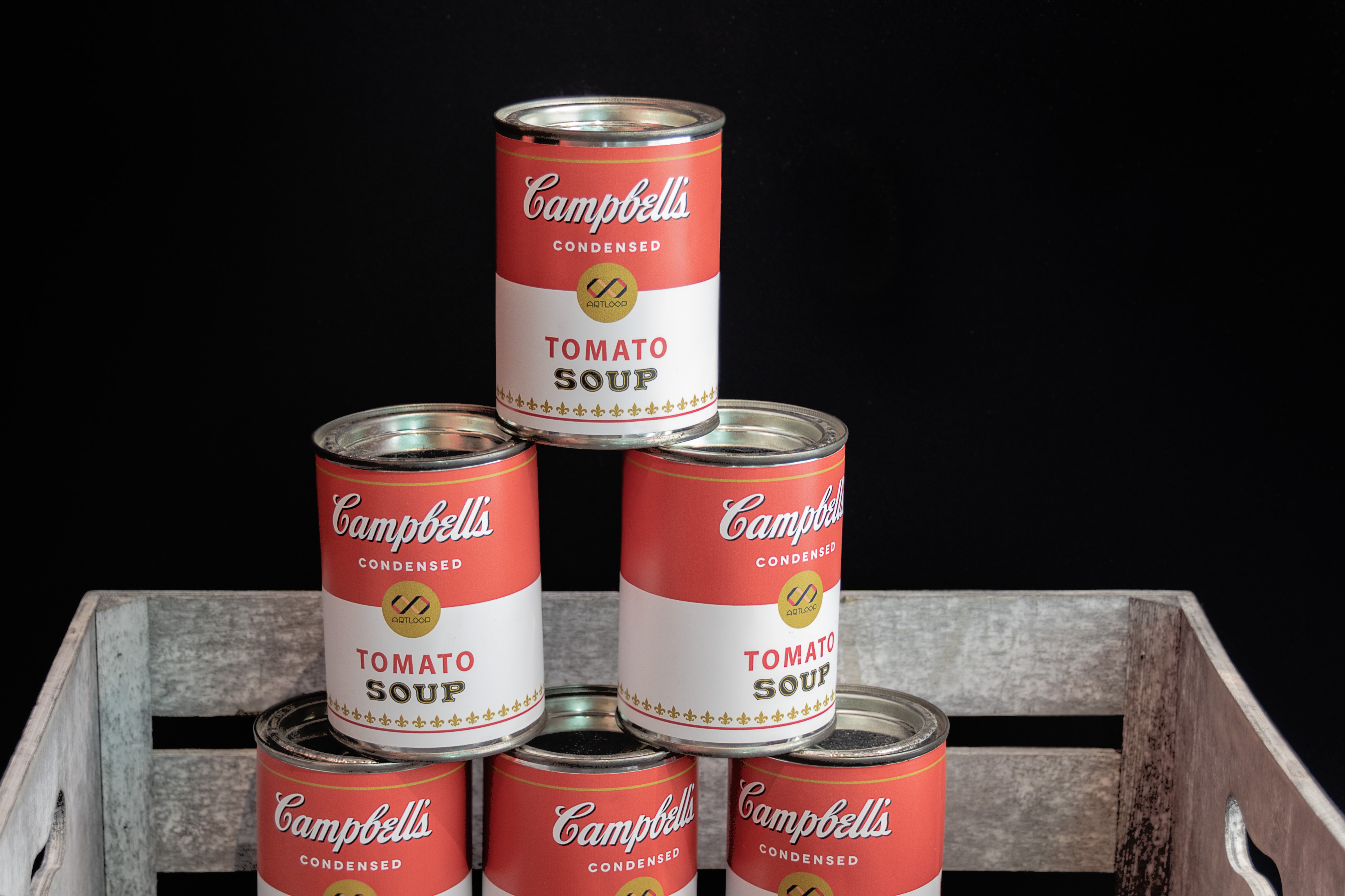 pile up of Campbell's tomato soup cans photo