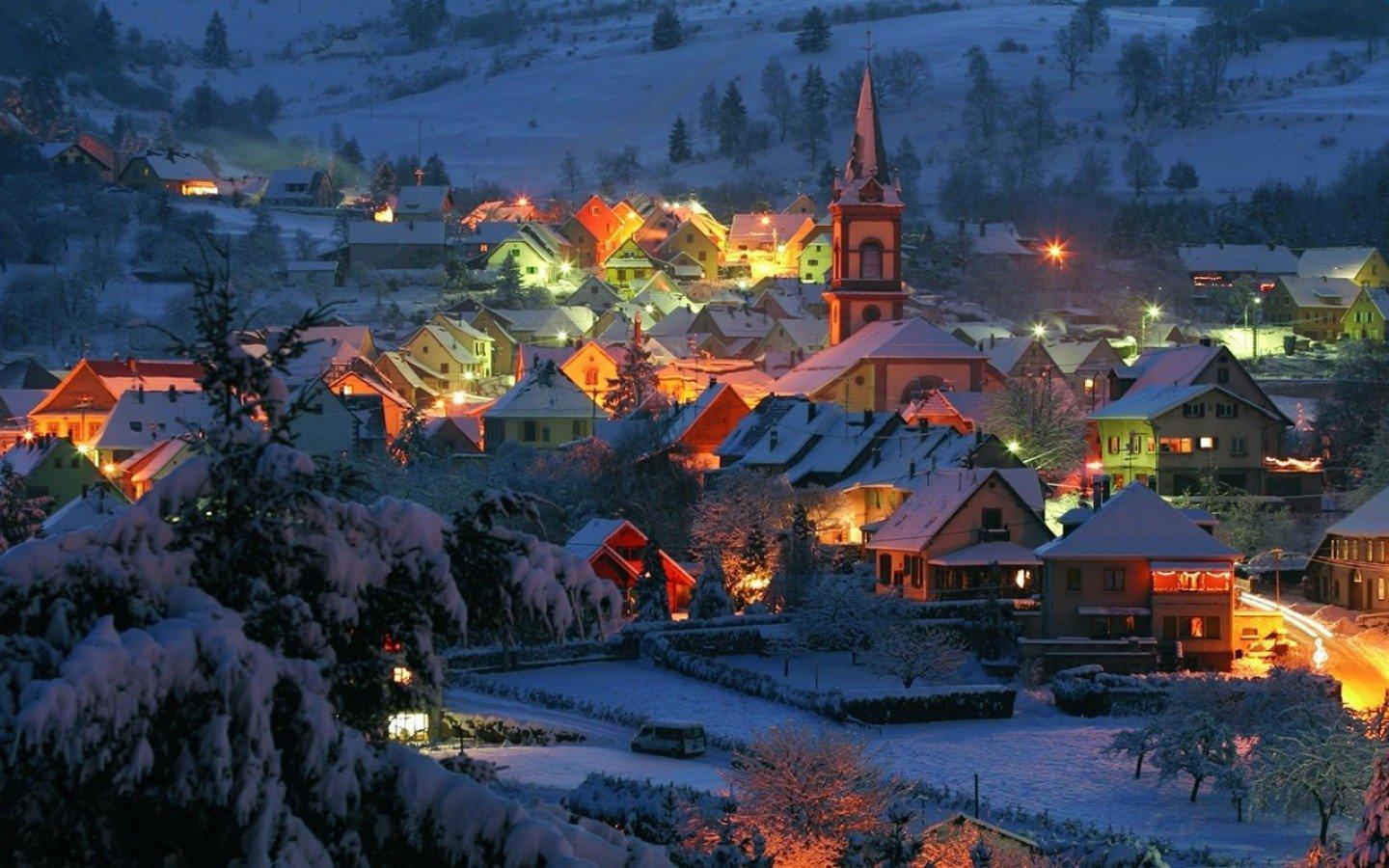 Lighted Village on a Winter Evening Wallpaper and Background