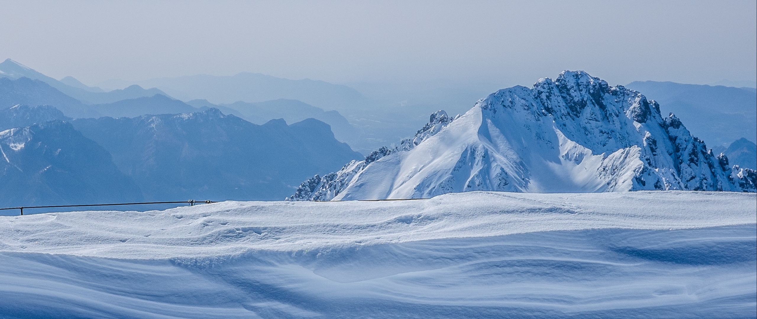 Download wallpaper 2560x1080 mountains, winter, snow, top
