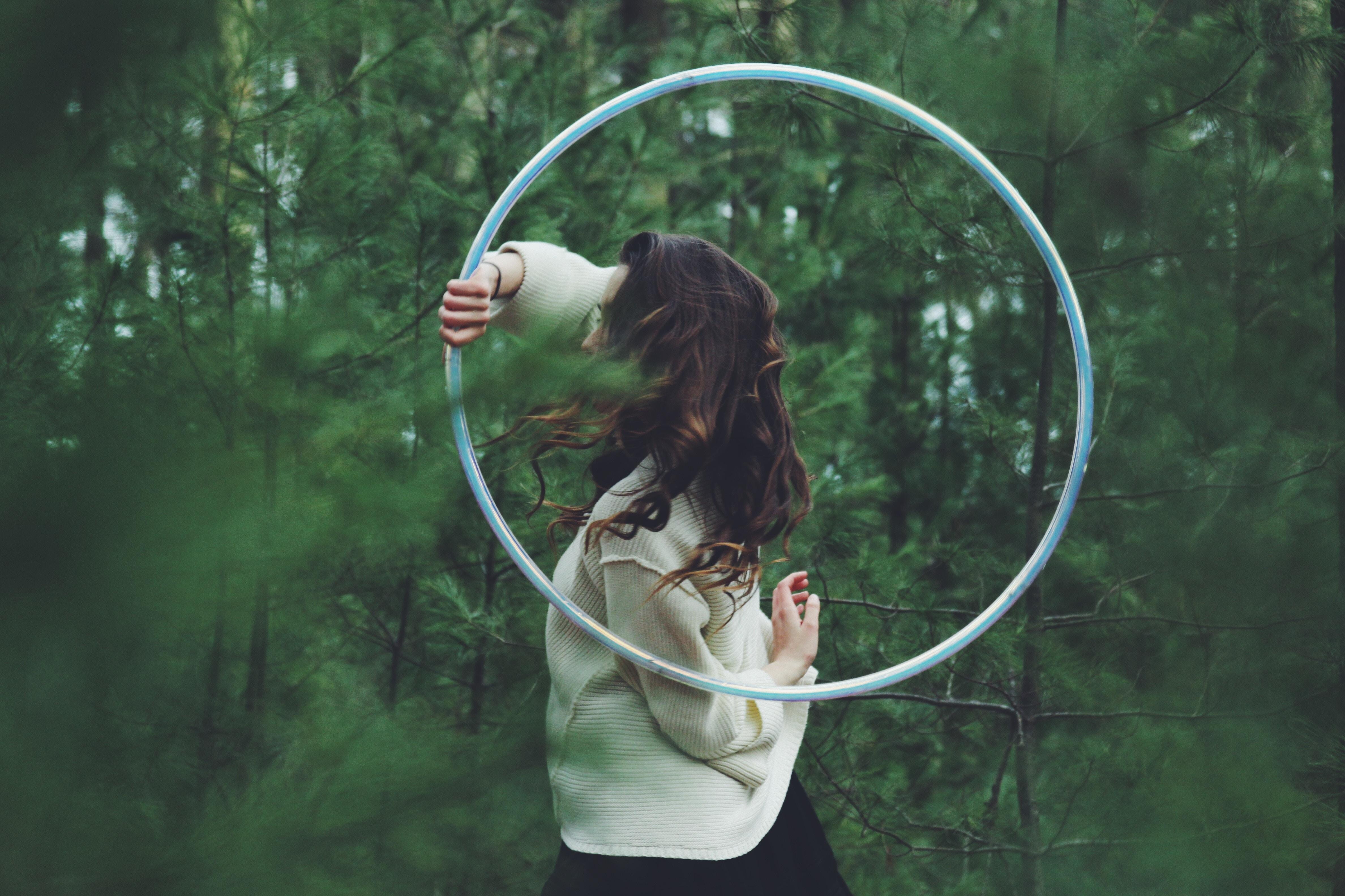 #plant, #female, #hoop, #blur, #holding, #forest