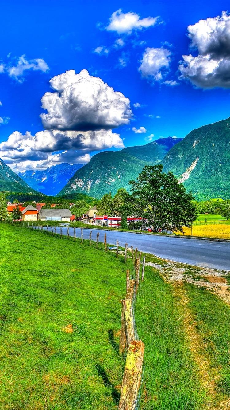 Wallpaper Slovenia, mountains, clouds, road, fence, grass
