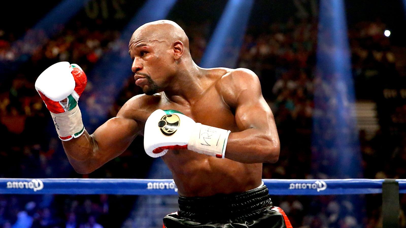 Download Floyd Mayweather Triumphant With His Belt Wallpaper | Wallpapers .com