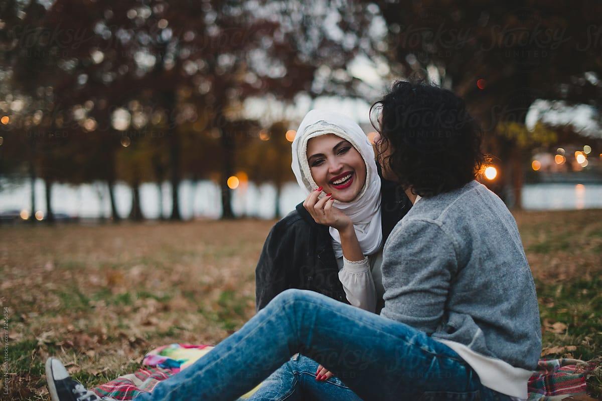Happy young Muslim couple in the park