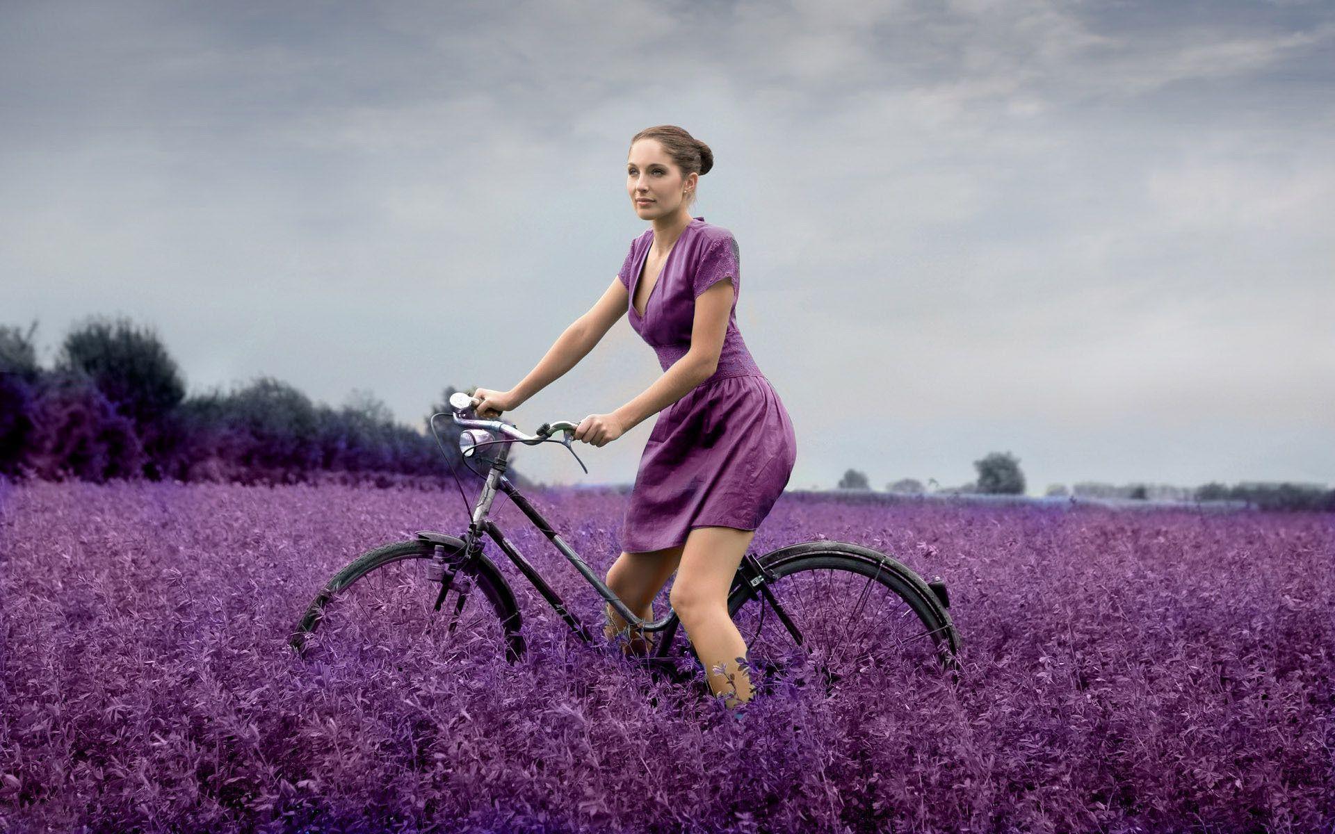 Riding the bike on a wild flowers field girl wallpaper