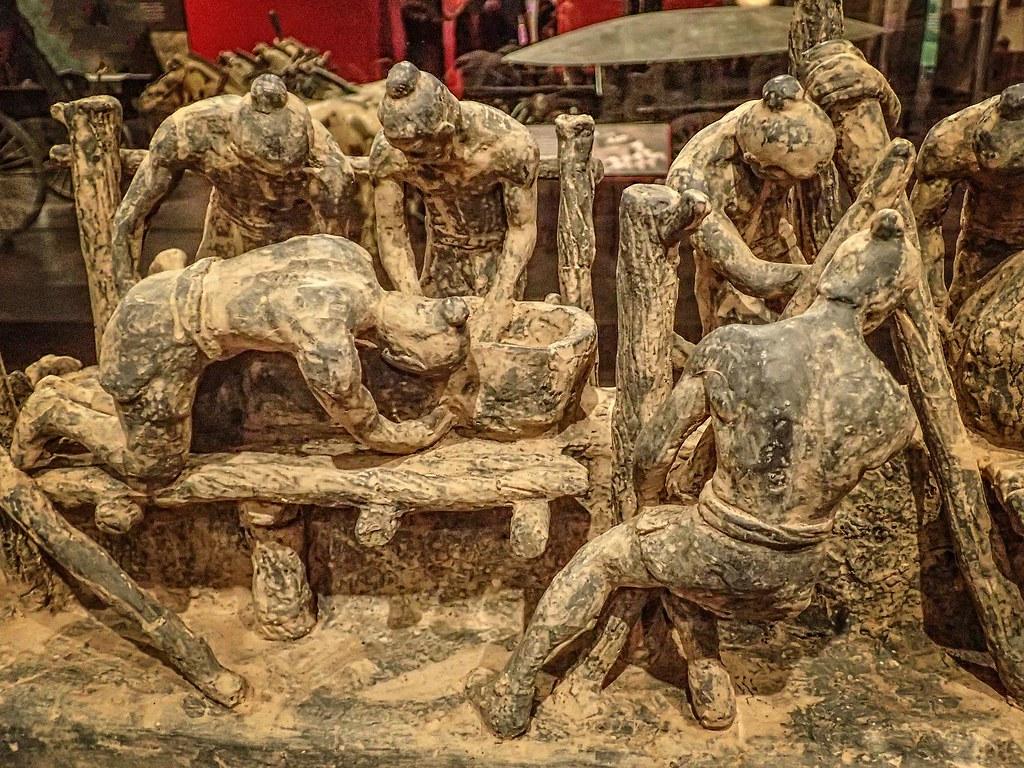 Model of workers creating figures for the tomb of Emperor