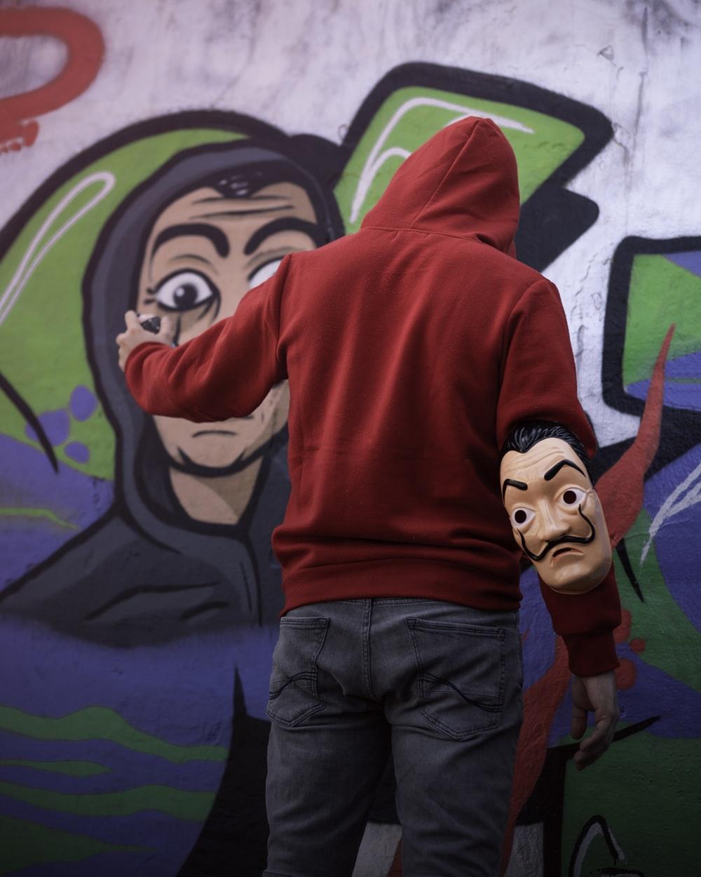 woman wearing red pullover hoodie photo