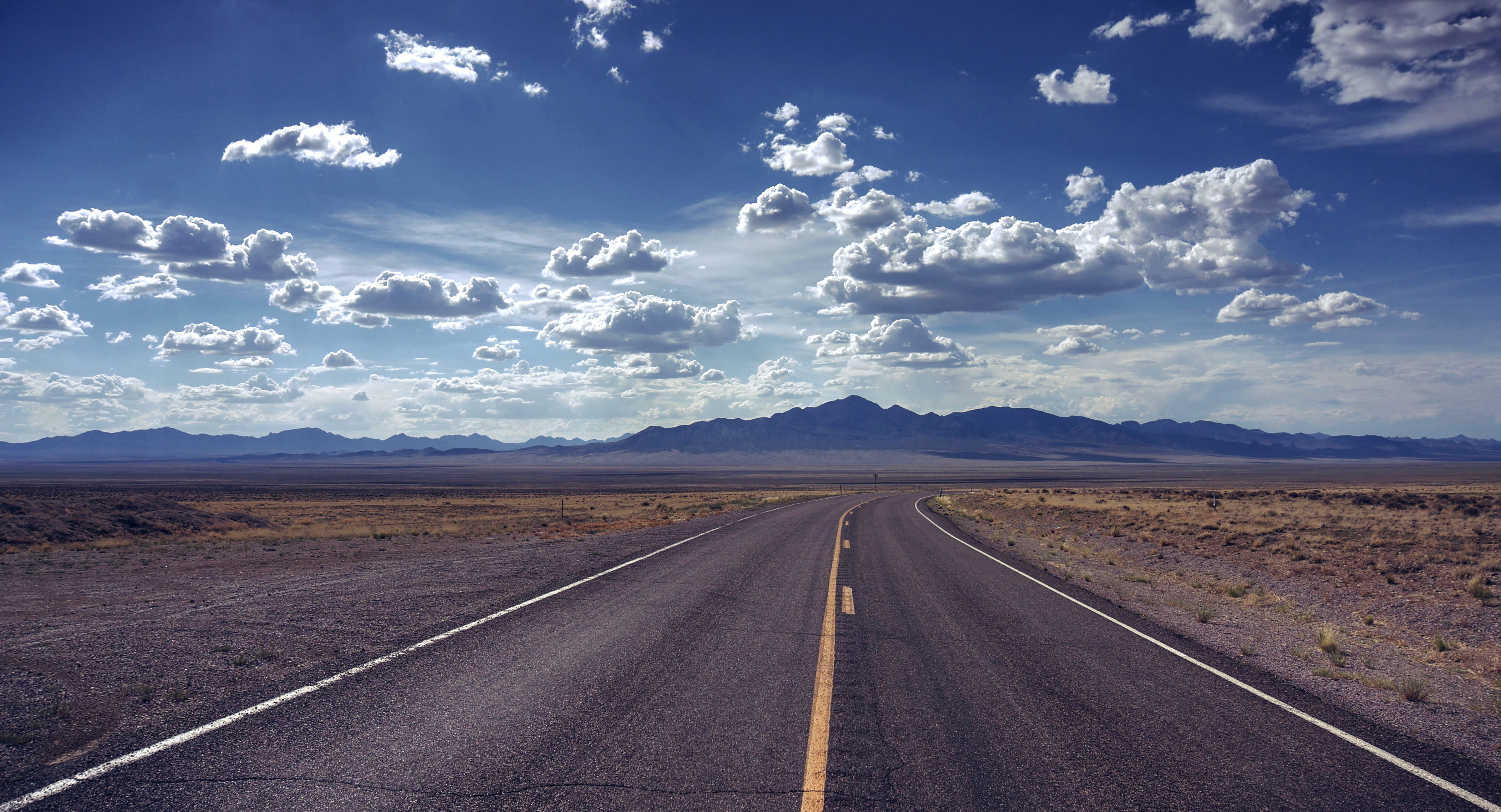 Photo of empty road during broad daylight, extraterrestrial highway HD wallpaper