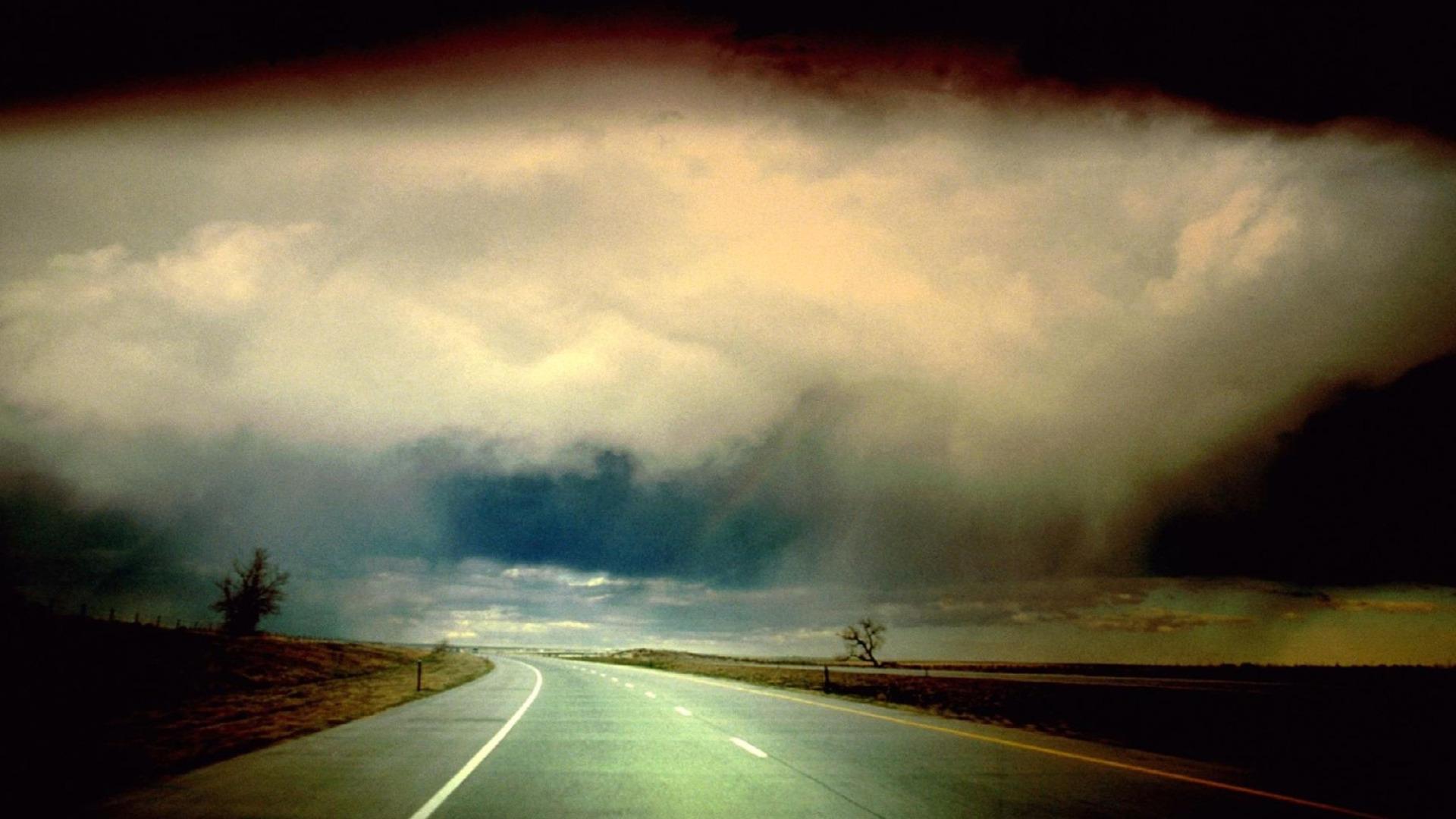 Download 1920x1080 Storm clouds over empty highway wallpaper