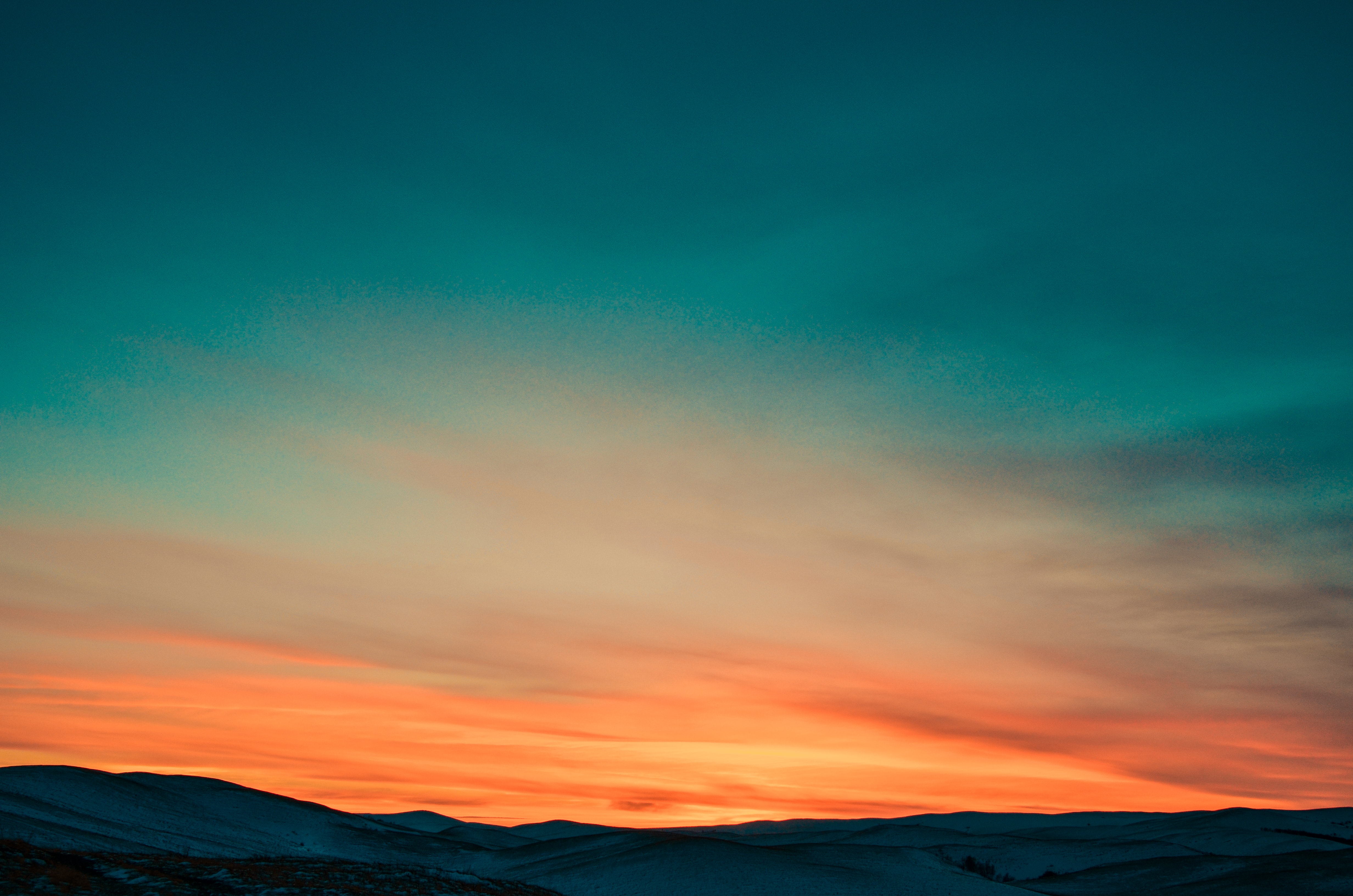 Sunset over Snow Covered Mountains · Free