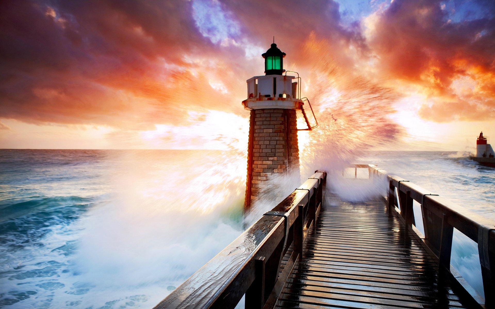 Lighthouse in Stormy Sea at Sunset HD Wallpaper. Background Image