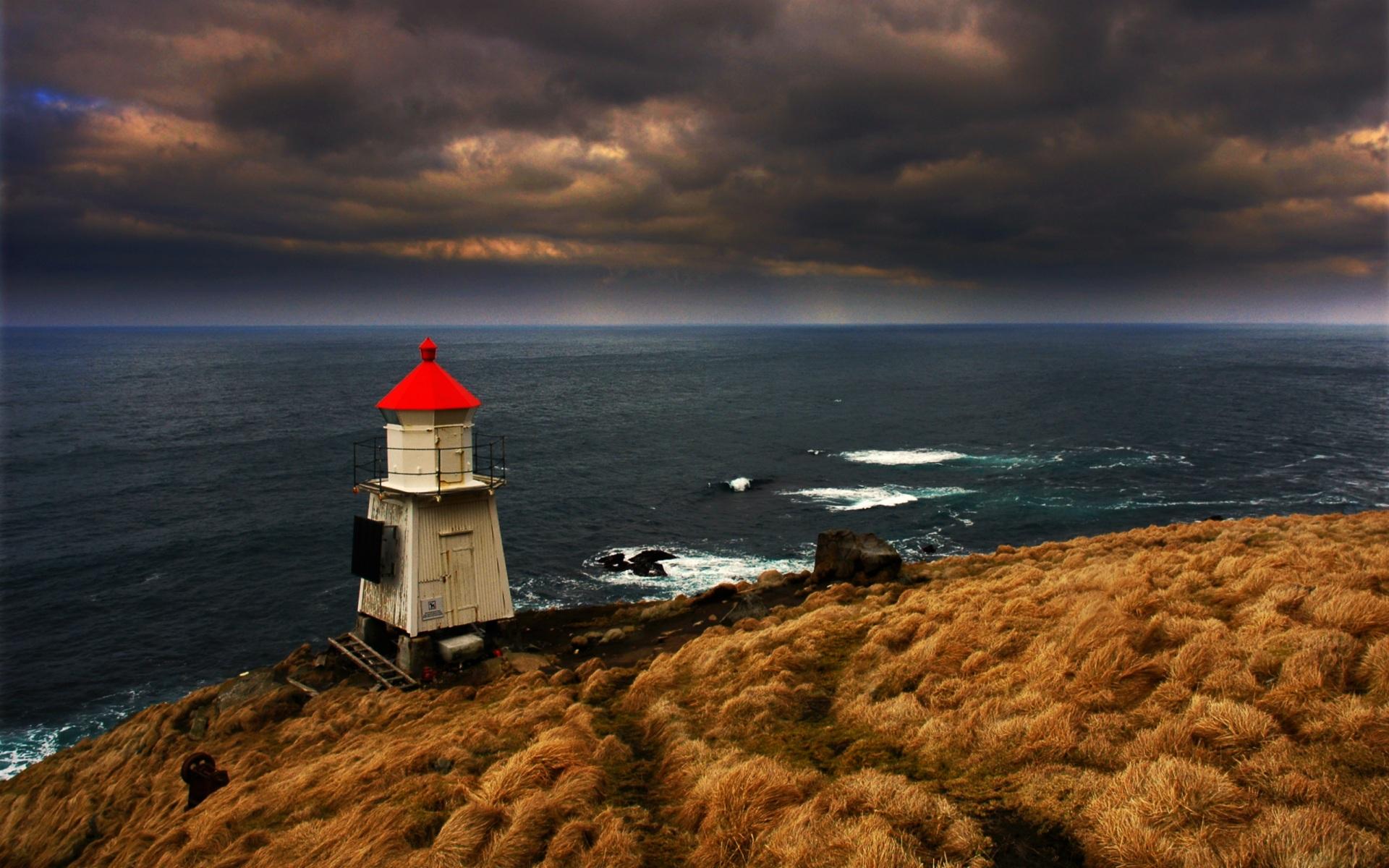 Download Wallpaper sea clouds shore lighthouse coast, 1920x1200