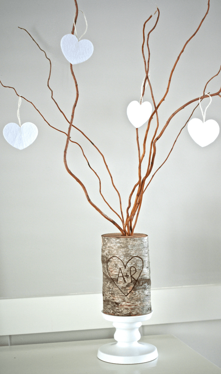 Make a rustic family tree with a birch log, branches, and some