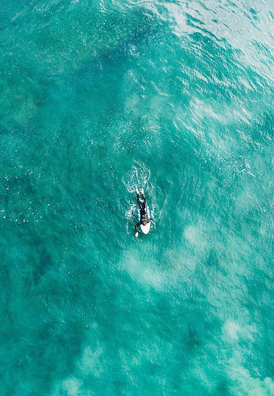 HD wallpaper: aerial photography of person lying on white surf