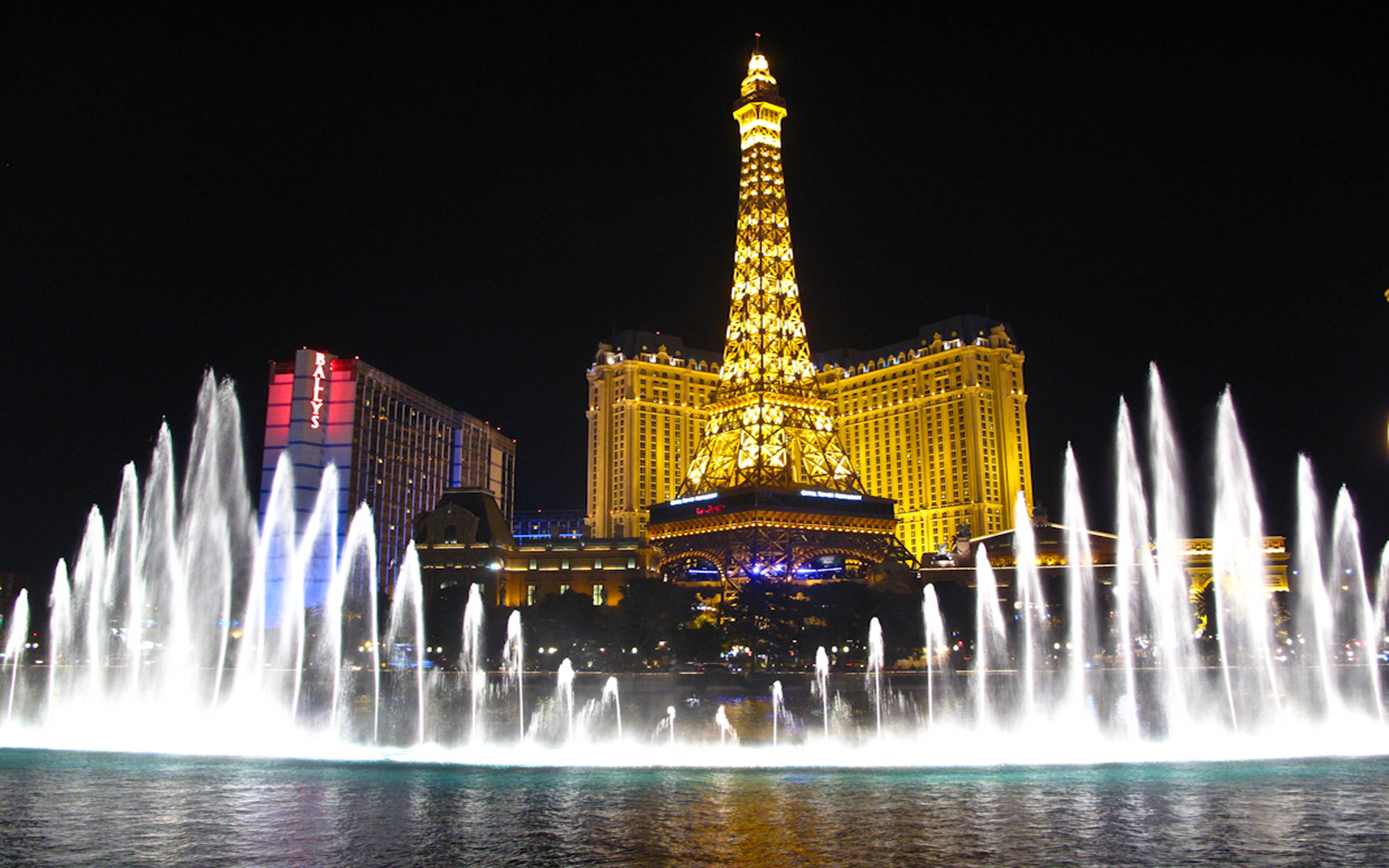 Bellagio Fountains And Hotel Paris With Eiffel Tower Las Vegas