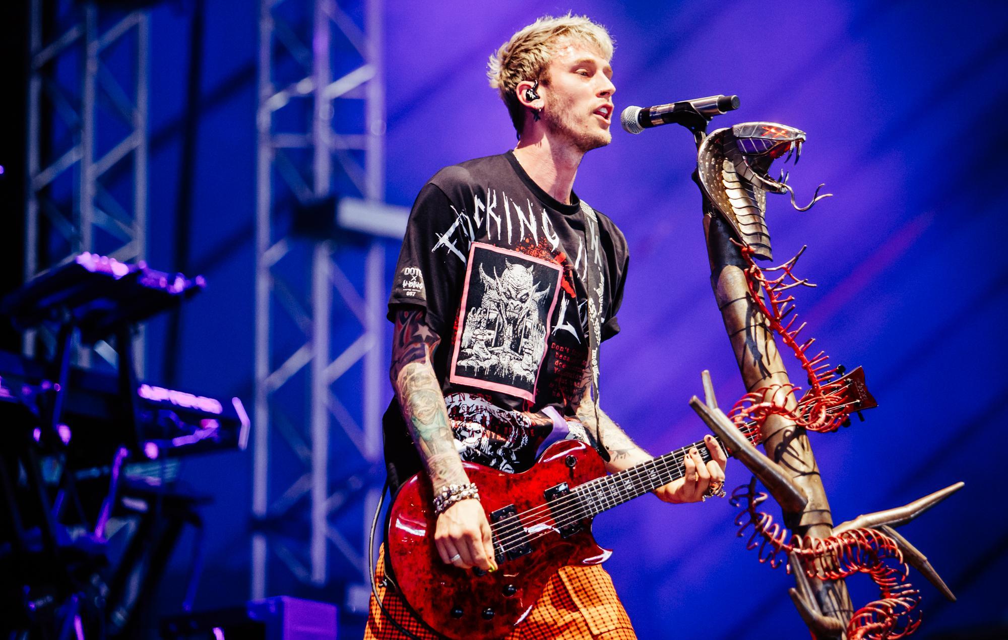 Watch Machine Gun Kelly perform with fans on the balcony