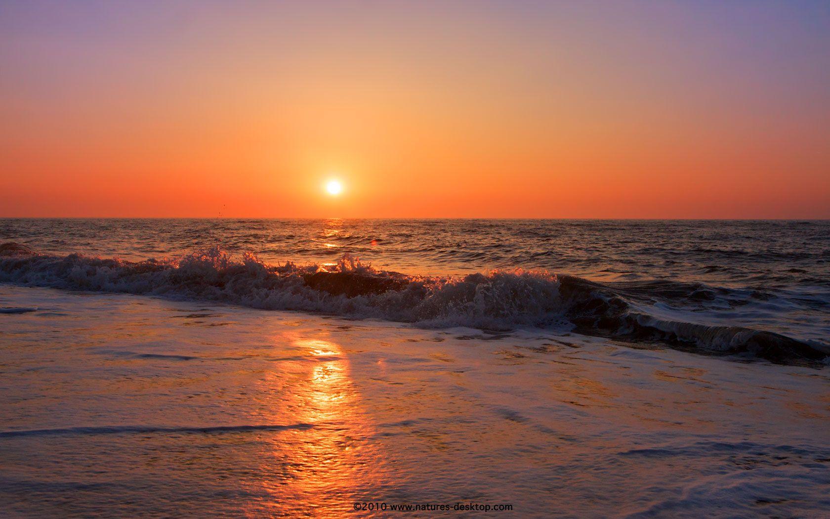 sunrise over water photo. Golden Sunrise Over Waves at Southwold