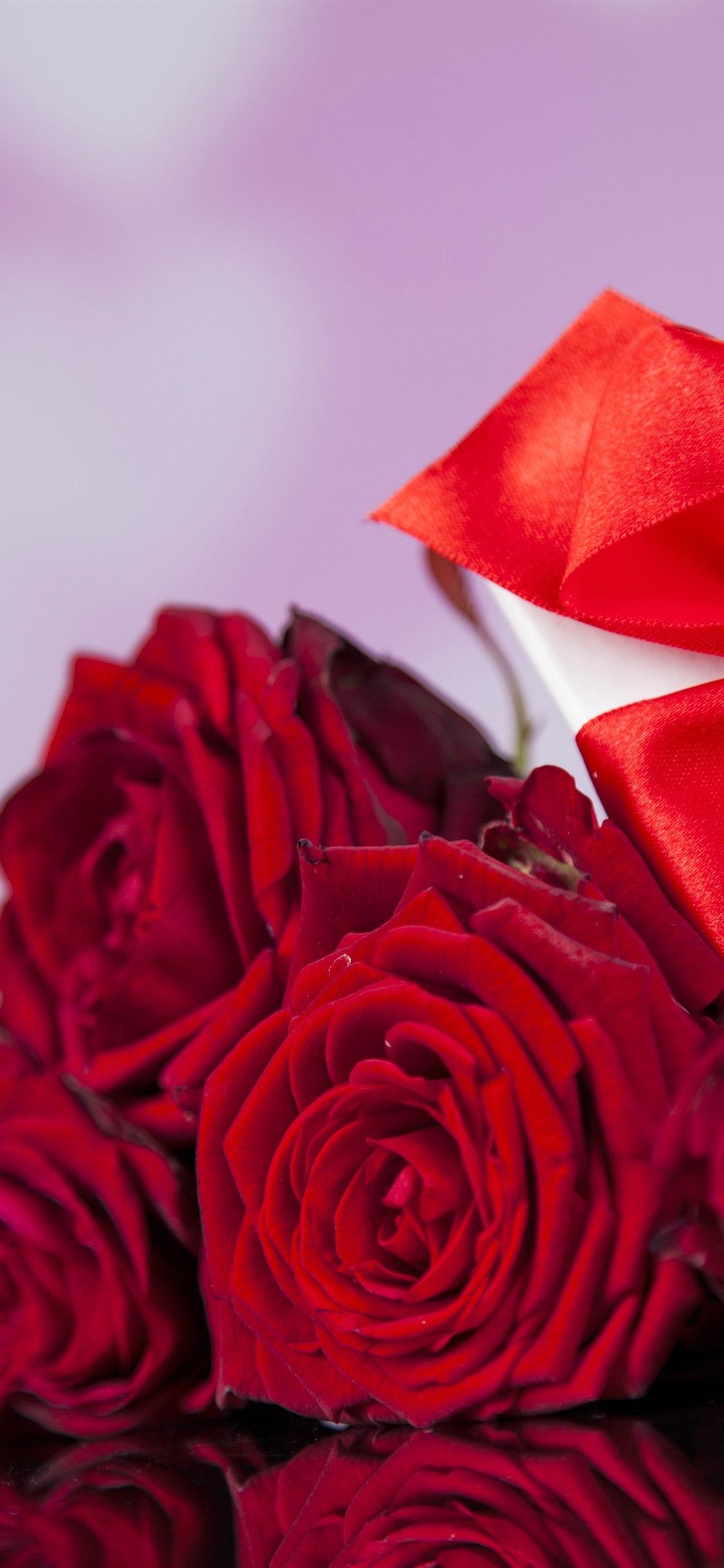 Red roses, gift, romantic, love 1125x2436 iPhone XS/X wallpapers